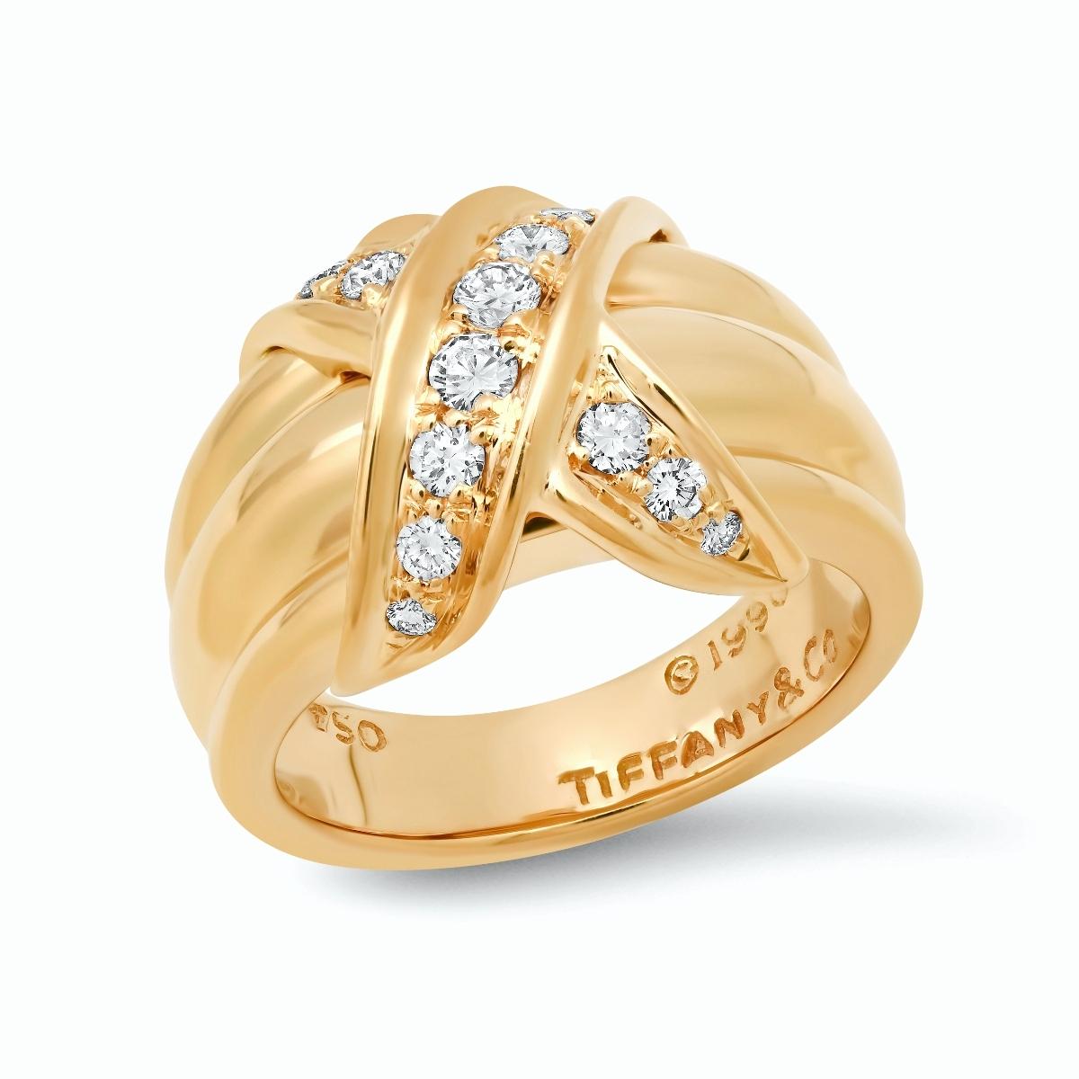 TIFFANY & Co. 18K Gold Diamond Signature X Ring 5.5
 
 Metal: 18K Yellow Gold
 Size: 5.5
 Width: 13mm at the widest point
 Weight: 10.0 grams
 Diamond: 14 round brilliant diamonds, carat total weight .35
 Hallmark: 750 ©1990 TIFFANY&Co.
 Condition: