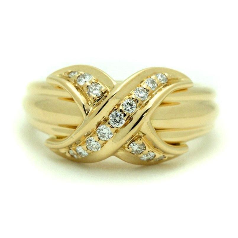 TIFFANY & Co. 18K Gold Diamond Signature X Ring 7
 
 Metal: 18K Yellow Gold
 Size: 7
 Weight: 6.80 grams
 Diamond: round brilliant diamonds, carat total weight .16
 Hallmark: 750 ©1990 TIFFANY&Co.
 Condition: Excellent condition, like new


Limited