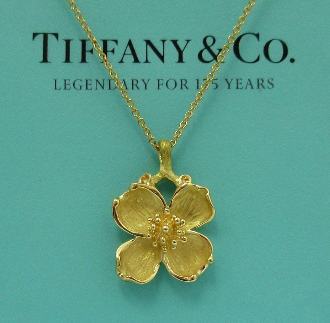 TIFFANY & Co. 18K Gold Dogwood Pendant Necklace

Metal: 18K Yellow Gold
Weight: 5.60 grams
Chain: 16