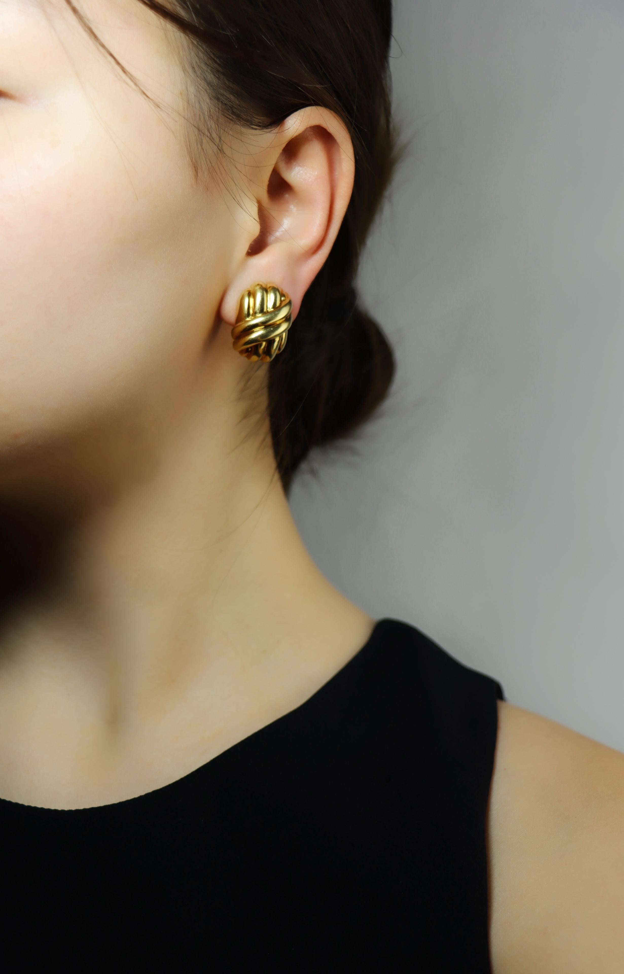 Tiffany & Co. 18K Gold Earrings

Marked:
Tiffany & Co.
18K

Approximate Dimensions:
2.2 cm (Length) 
1.7 cm (Width)
16.5 grams in weight.