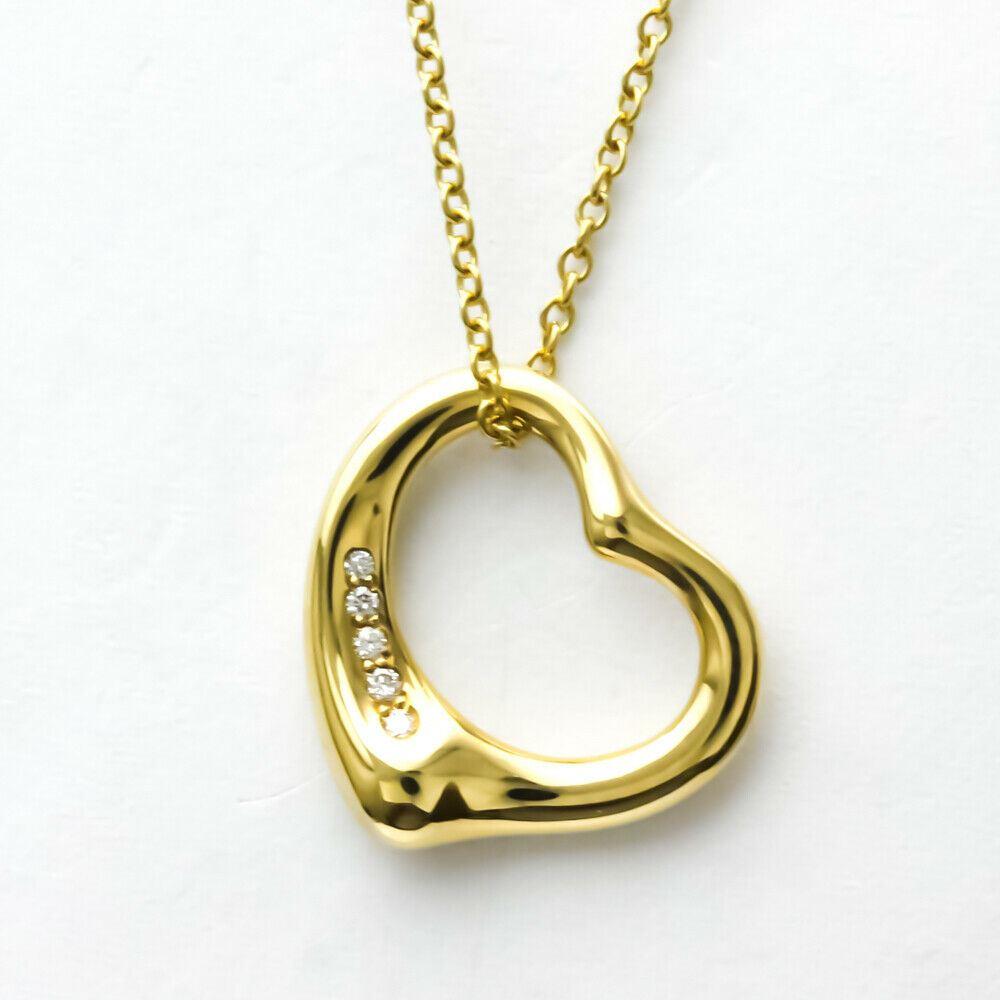 TIFFANY & Co. Elsa Peretti 18K Gold 5 Diamond 16mm Open Heart Pendant Necklace 

Metal: 18K Yellow Gold
Weight: 4.50 grams 
Chain: 16