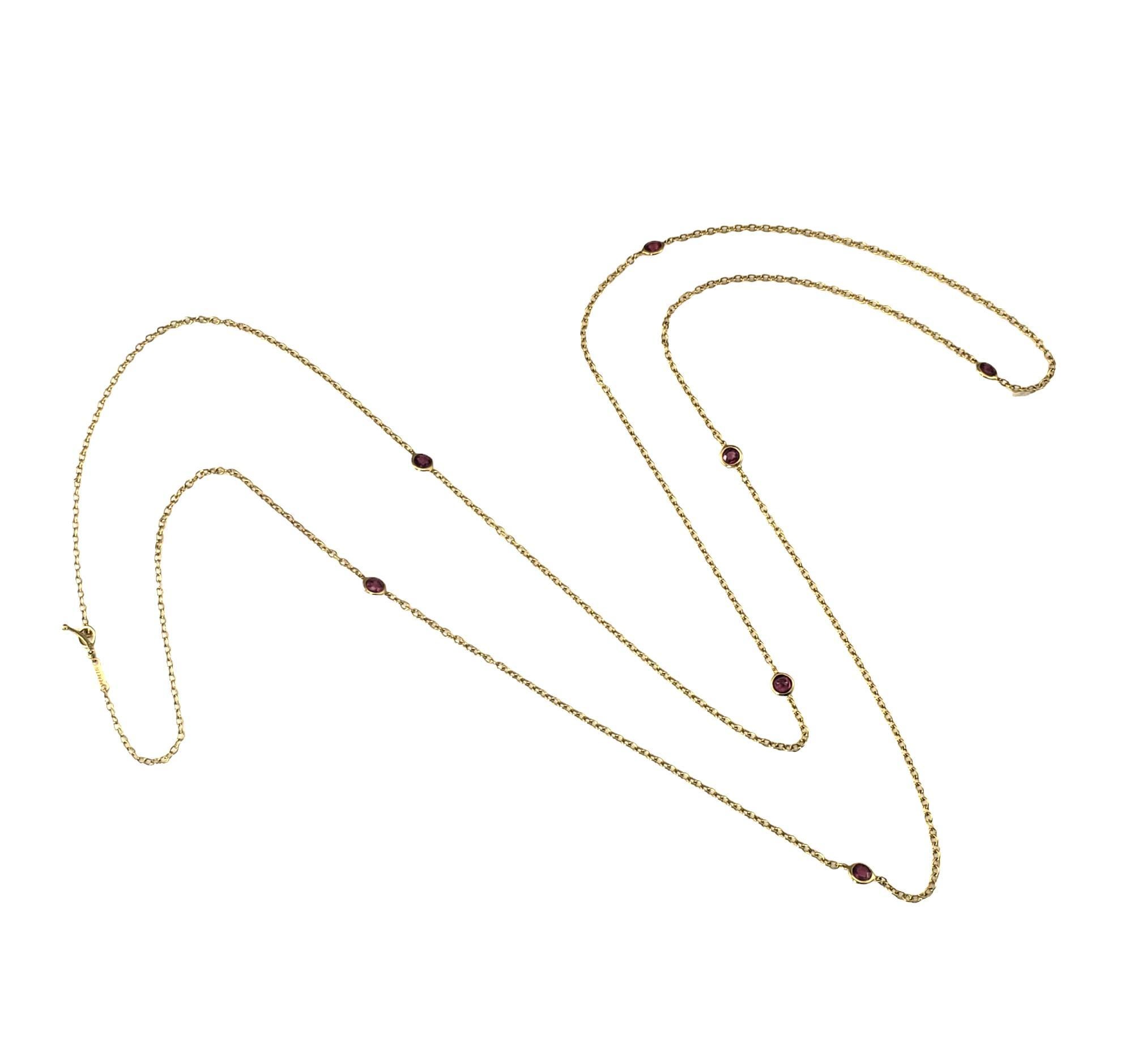 Tiffany & Co. Elsa Peretti Color by the Yard 18K Yellow Gold and Ruby Necklace

This elegant station necklace features seven bezel set rubies (5 mm)  on a classic 18K yellow gold chain.  By Elsa Peretti for Tiffany & Co. Toggle closure.

Size: 39