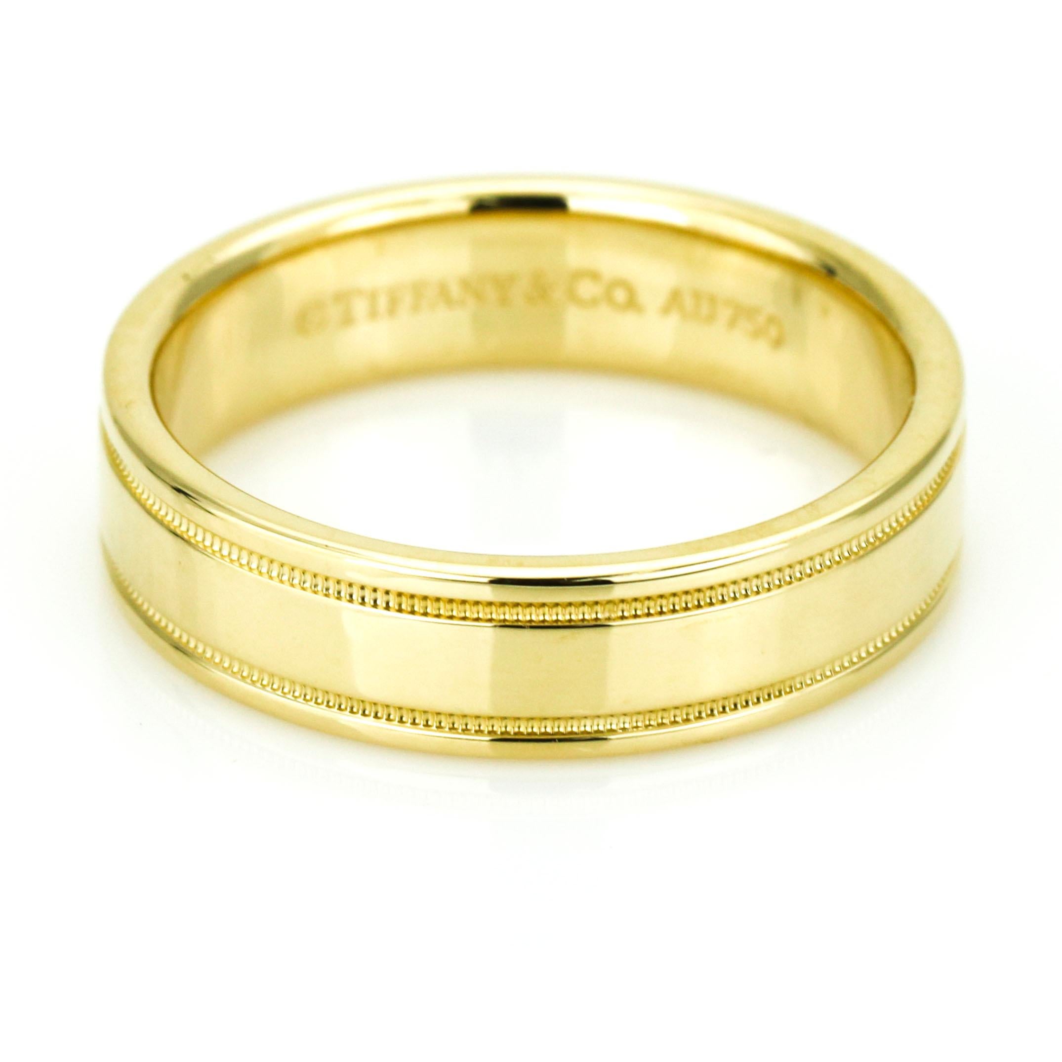 Tiffany & Co. 6mm essential band double milgrain men's ring in 18-karat yellow gold.

Size, 11
Outside Diameter, 24.5mm
Width, 6mm
Depth, 2mm
Weight, 10.84 grams
