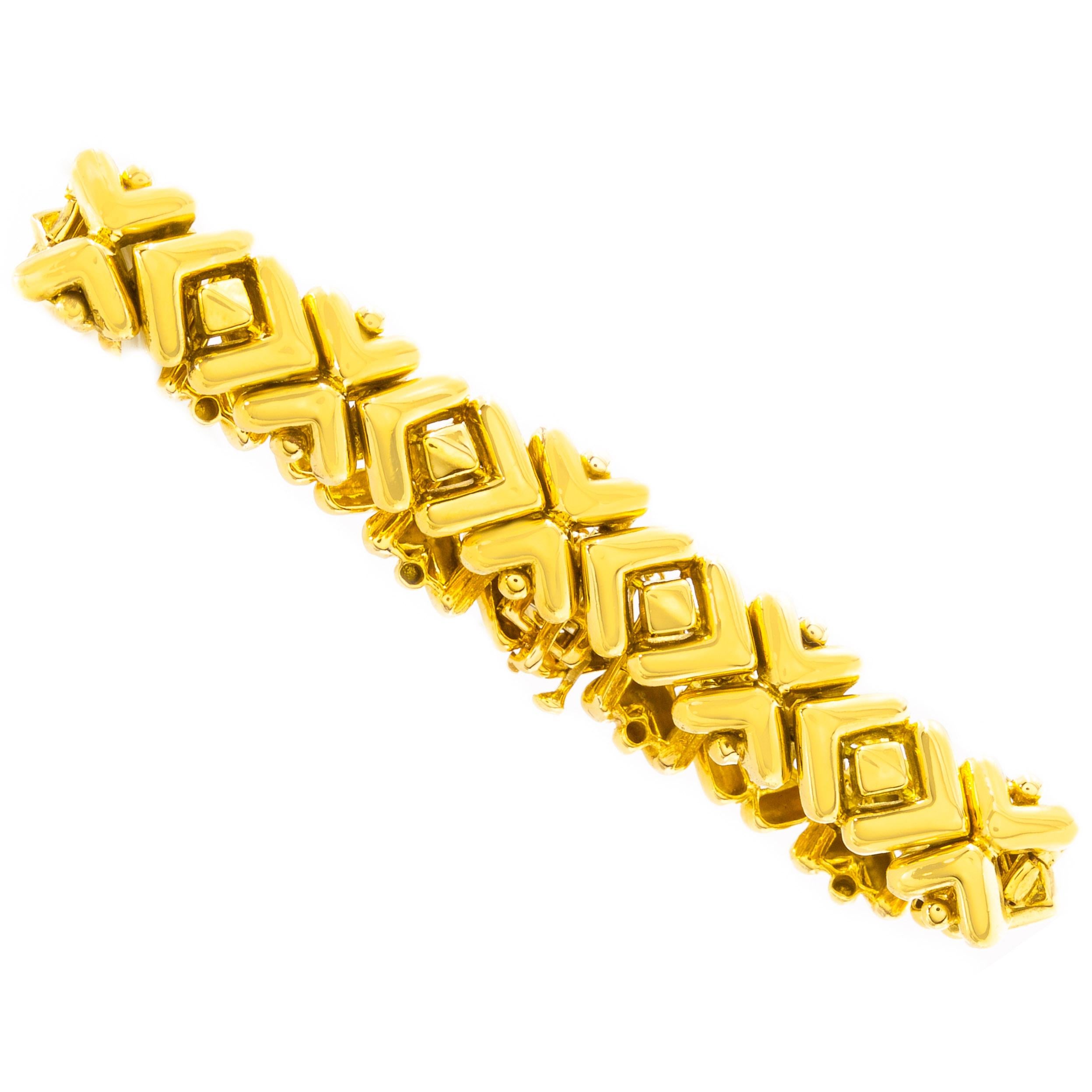 An exquisite work of art, this finely made bracelet features a series of geometric bracket forms simulating a repeating X and O. These are each individually cast and attach with hidden integral pins to allow for the flexible profile without losing