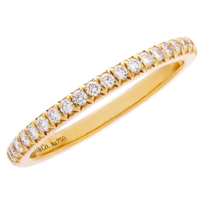 TIFFANY & Co. 18K Yellow Gold Half Circle Diamond Soleste Band Ring 5.5 

Metal: 18K yellow gold  
Size: 5.5 
Width: 2mm
Diamond: round brilliant diamonds, carat total weight .17 
Hallmark: ©TIFFANY&Co. Au750
Condition: Excellent condition, like new