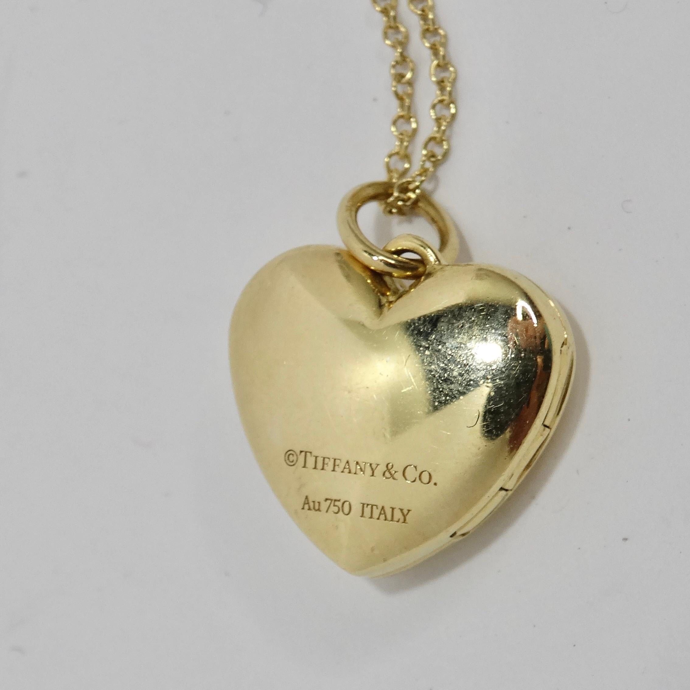 Elevate your jewelry collection with the Tiffany & Co 18K Gold Heart Locket – a symbol of timeless elegance and a piece that holds your cherished memories close to your heart. This exquisite necklace features a mini heart-shaped locket pendant