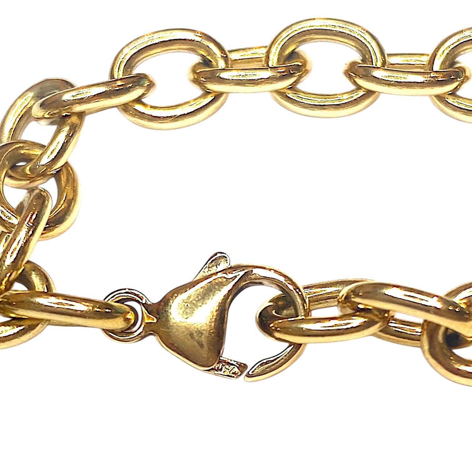 TIFFANY & Co. 18K yellow gold heart tag charm bracelet.
Length: 7 inches. Length could be adjusted to fit smaller wrist by moving the lobster clasp to any link on the bracelet. 
Weight: 27.4 grams
Marked: 