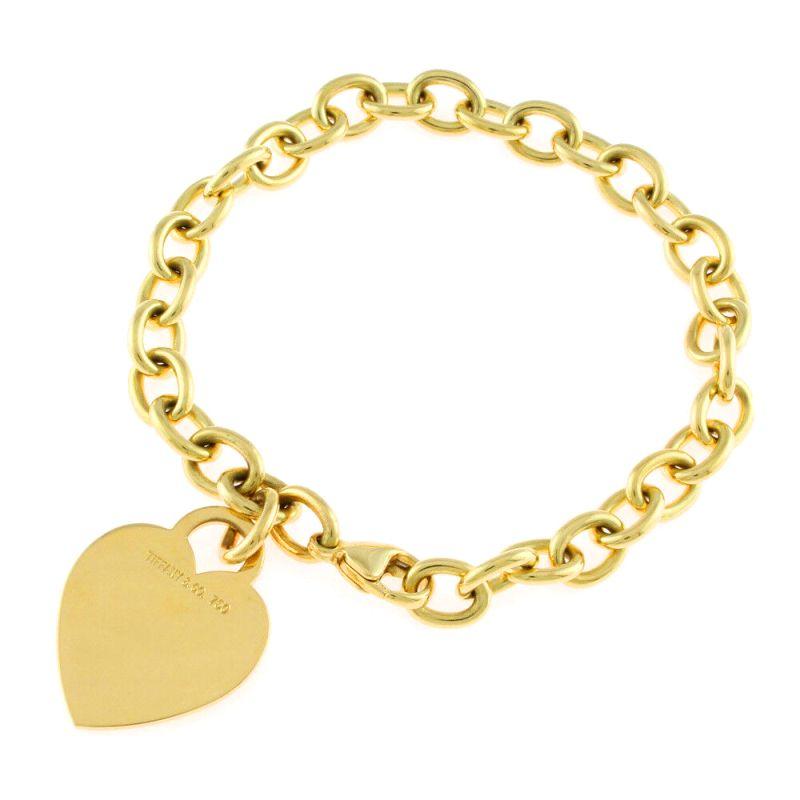 TIFFANY & Co. 18K Gold Heart Tag Charm Bracelet

Metal: 18K Yellow Gold
Weight: 27.20 grams
Length: 7.25