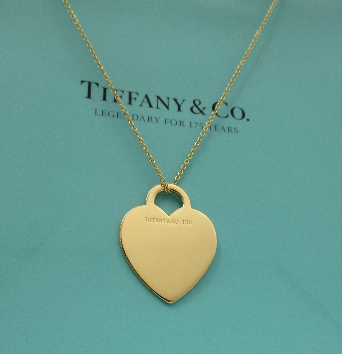TIFFANY & Co. 18K Gold Heart Tag Pendant Necklace Large Size

Metal: 18K Yellow Gold
Weight: 7.20 grams
Chain: 16