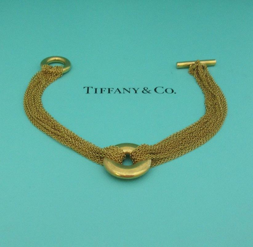 TIFFANY & Co. 18K Gold Multi Strand Mesh Circle Toggle Bracelet

Metal: 18K Yellow Gold
Length: 7