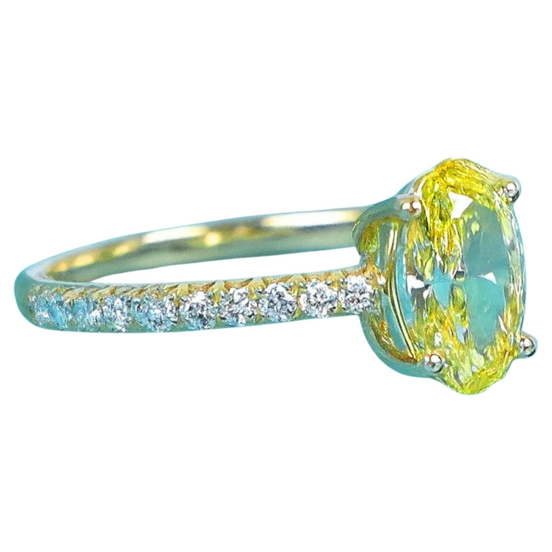 Tiffany & Co. 18K Gold Novo Fancy Vivid Yellow Oval Diamond Engagement Ring

From Tiffany’s celebrated Novo Collection, this engagement ring features a striking oval cut Fancy Vivid Yellow diamond weighing 1.04 carats, graded VS1 clarity. The vivid
