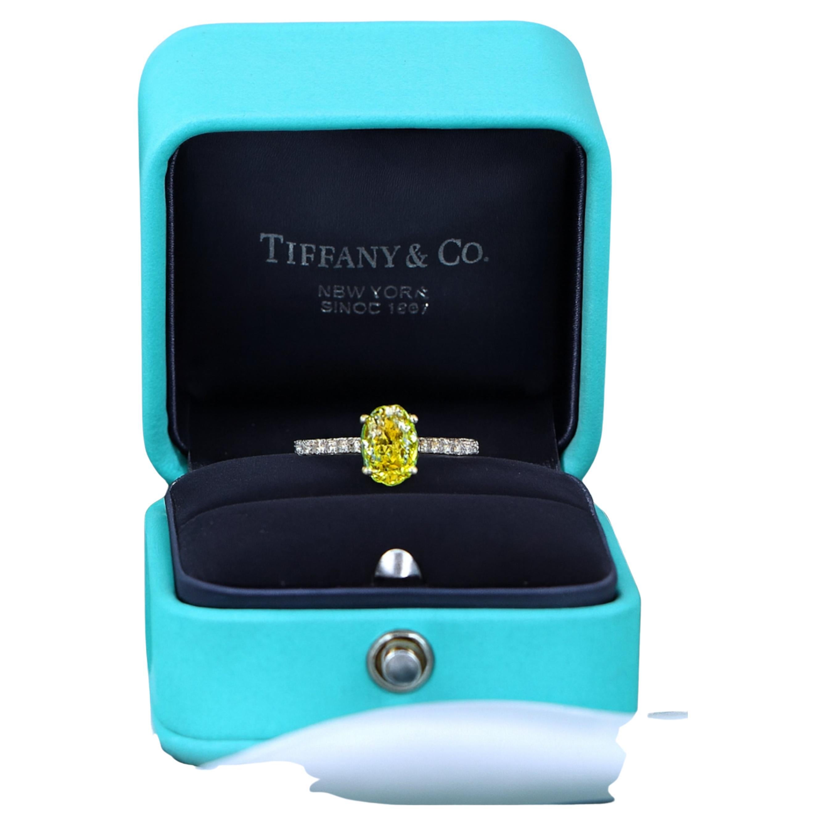 Modern Tiffany & Co. 18K Gold Novo Fancy Vivid Yellow Oval Diamond Engagement Ring For Sale