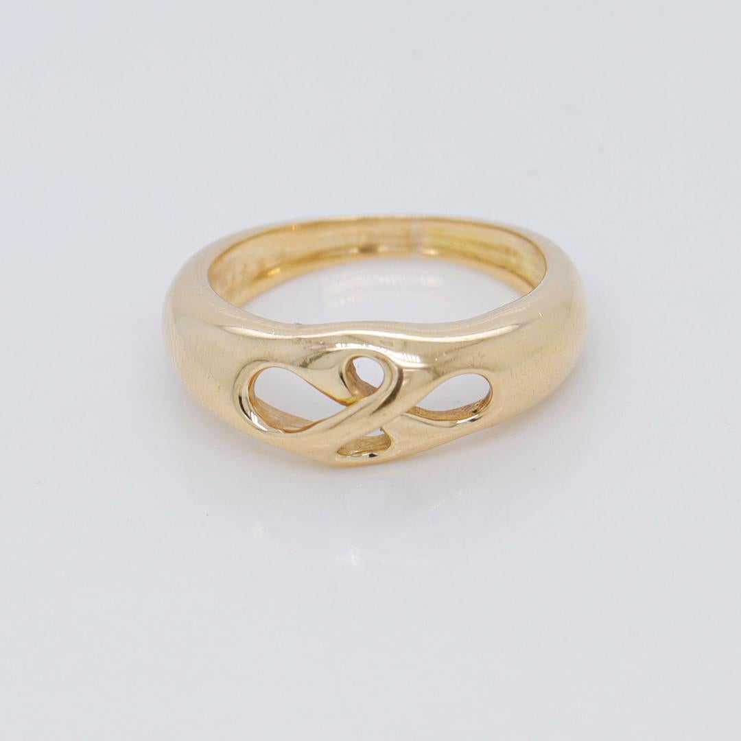 Tiffany & Co. 18K Gold Openwork Infinity Love Knot Band Ring For Sale 2