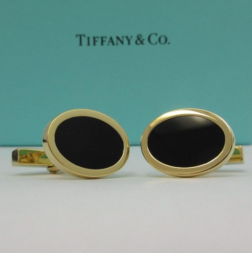 TIFFANY & Co. 18K Gold Oval Black Onyx Cufflinks

Metal: 18K Yellow Gold 
Weight: 14.90 grams
Hallmark: TIFFANY&CO. 750
Condition: Excellent condition, like new

Limited edition, no longer available for sale in Tiffany stores

Authenticity guaranteed