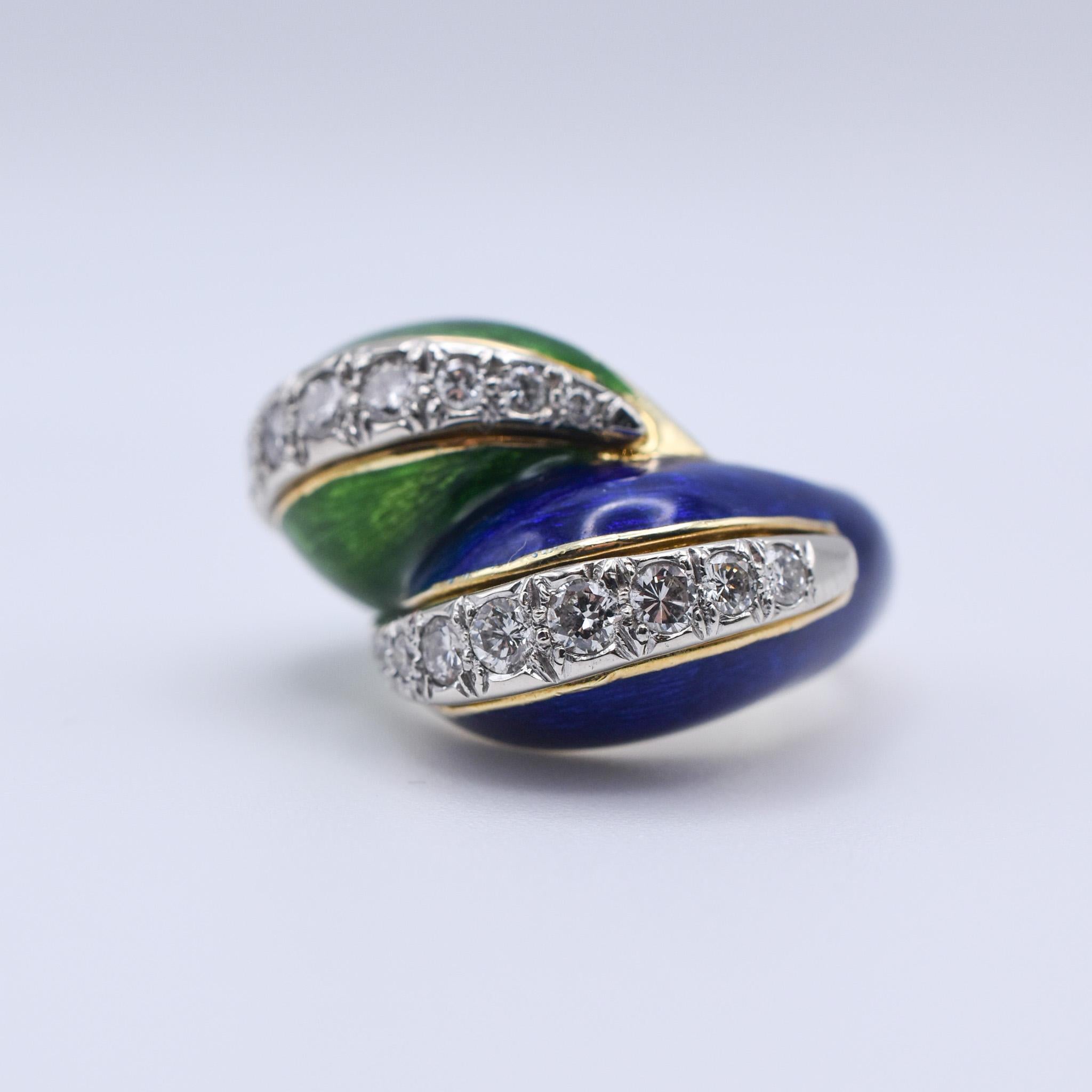 An exquisite Tiffany & Co. Paillonné twist ring in 18kt yellow gold with green and blue enamel, and round brilliant cut diamonds.  Circa 1960.