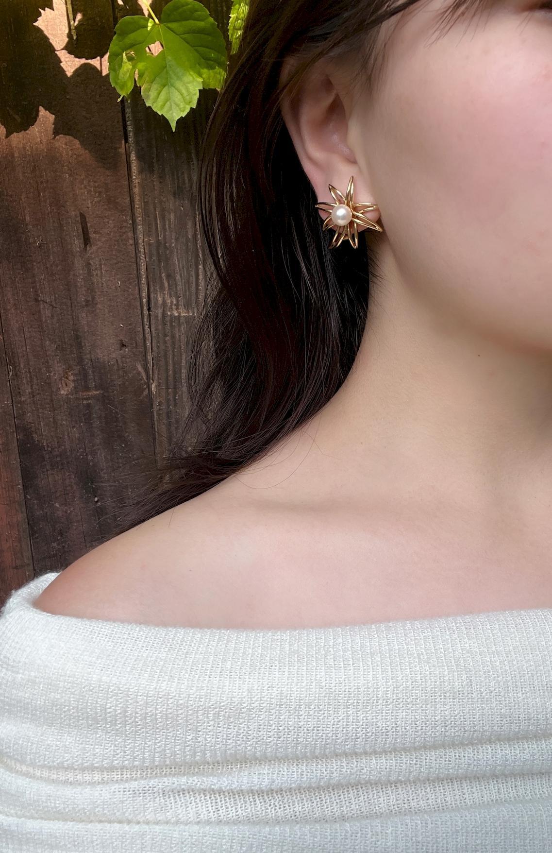 Tiffany & Co. 18K Gold & Pearl Firework Earrings
Stamped:
TIFFANY&CO. 750 FIREWORK 18K

Approximate Dimensions:
3 cm (Length) 
2.8 cm (Width)
7.20 - 7.32 mm(Pearl) 
13.4 grams in weight.