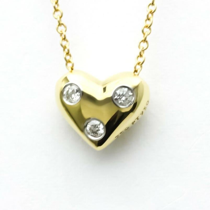 TIFFANY & Co. 18K Gold Platinum 3 Diamond Etoile Heart Pendant Necklace 

Metal: 18K Yellow Gold and Platinum 
Weight: 3.60 grams 
Chain: 16