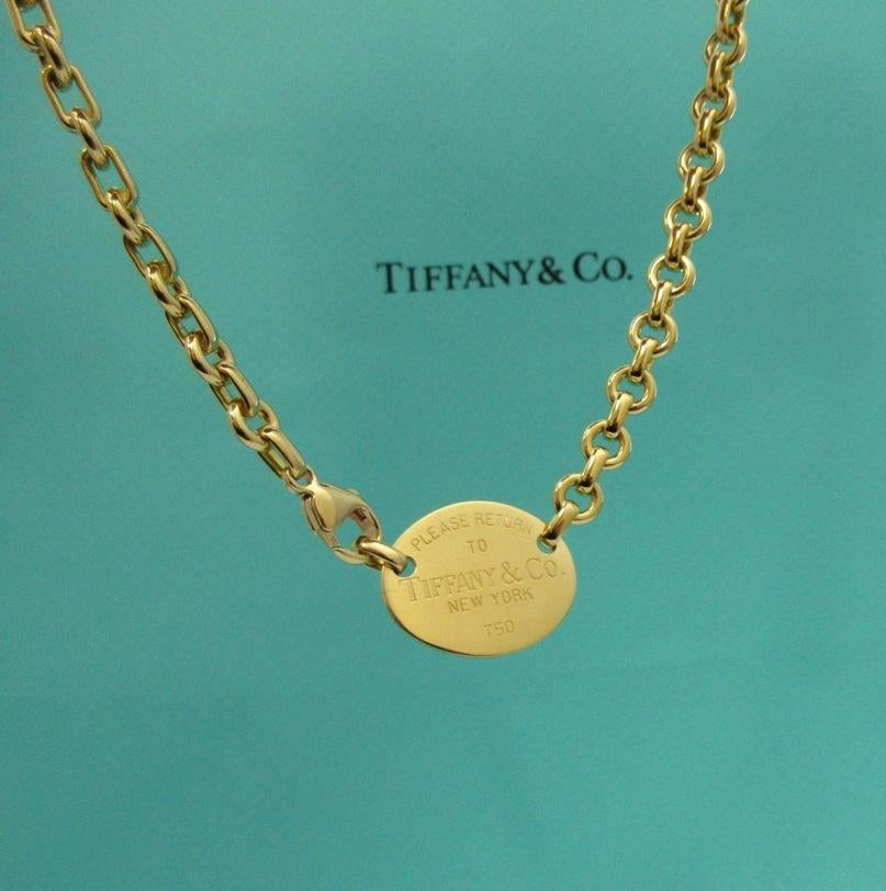 TIFFANY & Co. 18K Gold Rückkehr zu Tiffany Oval Tag Halskette  

Metall: 18K Gelbgold 
Länge: 16,5