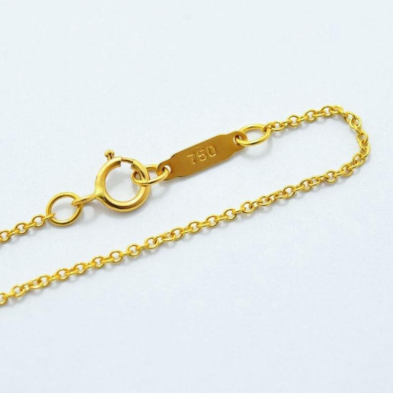 TIFFANY & Co. Collier pendentif cœur en or 18 carats avec ruban et nœud en vente 7