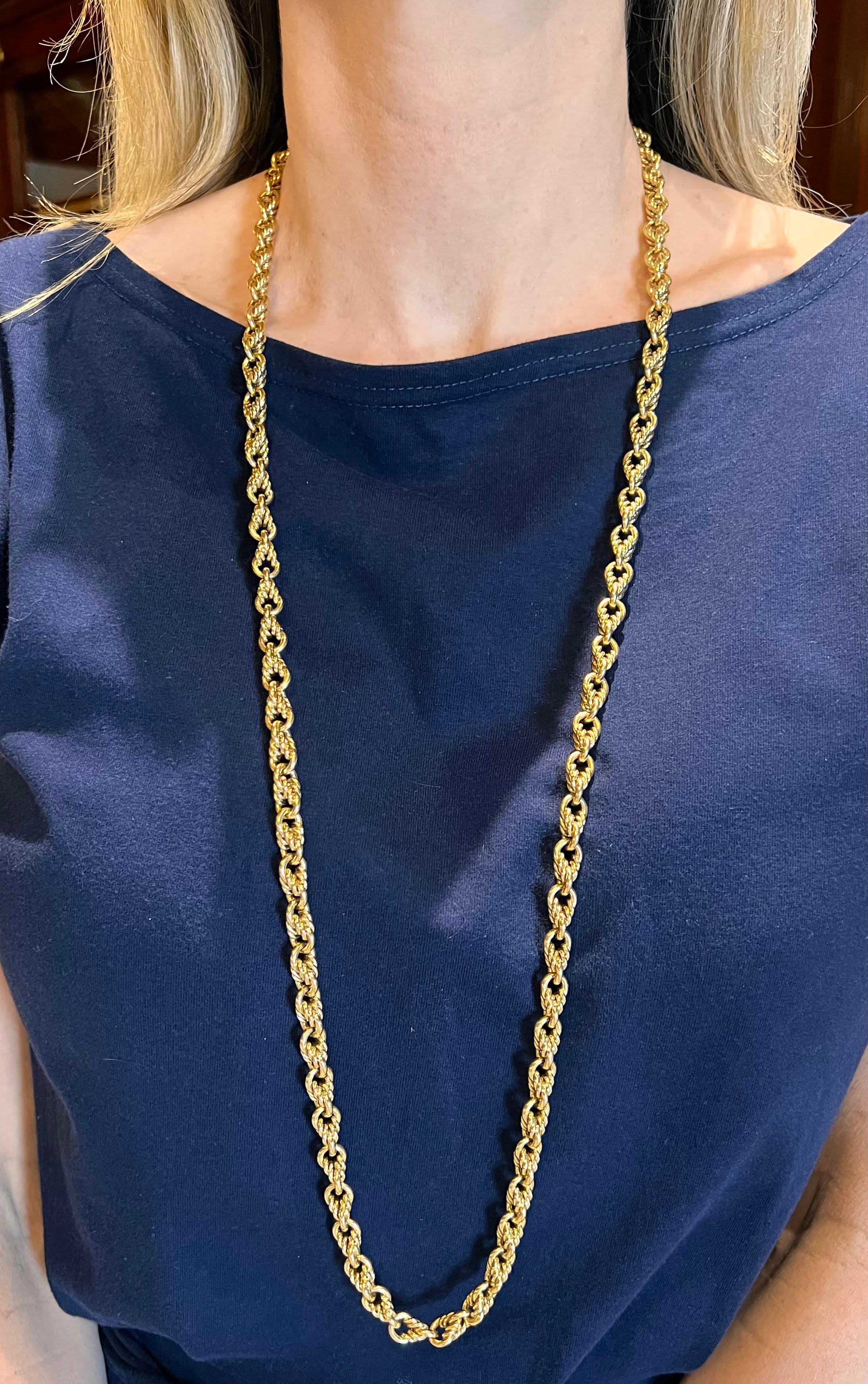 Twisted rope link neck chain by Tiffany in 18k yellow gold. Solid polished twisted rope links alternate with solid circular polished links.  Eternity design with no clasp. Signed '750 © TIFFANY & CO'.  Measuring 37 inches in length and 8.8mm in