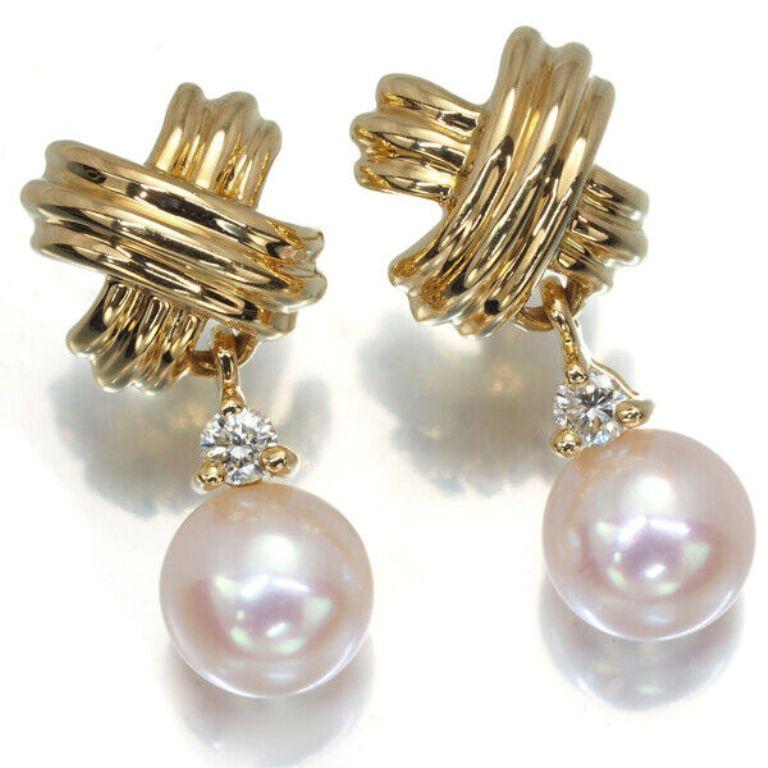 TIFFANY & Co. 18K Gold Signature Diamond Pearl Drop Earrings

Metal: 18K Yellow Gold
Measurement: 19mm long from top to bottom 
Weight: 3.90 grams
Pearl: 6.5mm
Diamond: two round brilliant diamonds, carat total weight .10 approximately
Hallmark:
