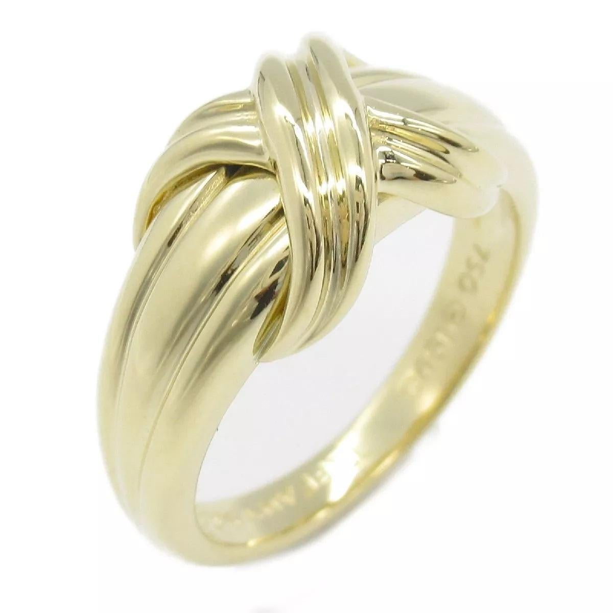 TIFFANY & Co. 18K Gold Signature X Ring 6

Metal: 18K yellow gold 
Size: 6
Width: 9.5mm at the widest point on the top
Weight: 5.60 grams
Hallmark: ©1990 TIFFANY&CO. 750
Condition: Excellent condition

Limited edition, no longer available for sale
