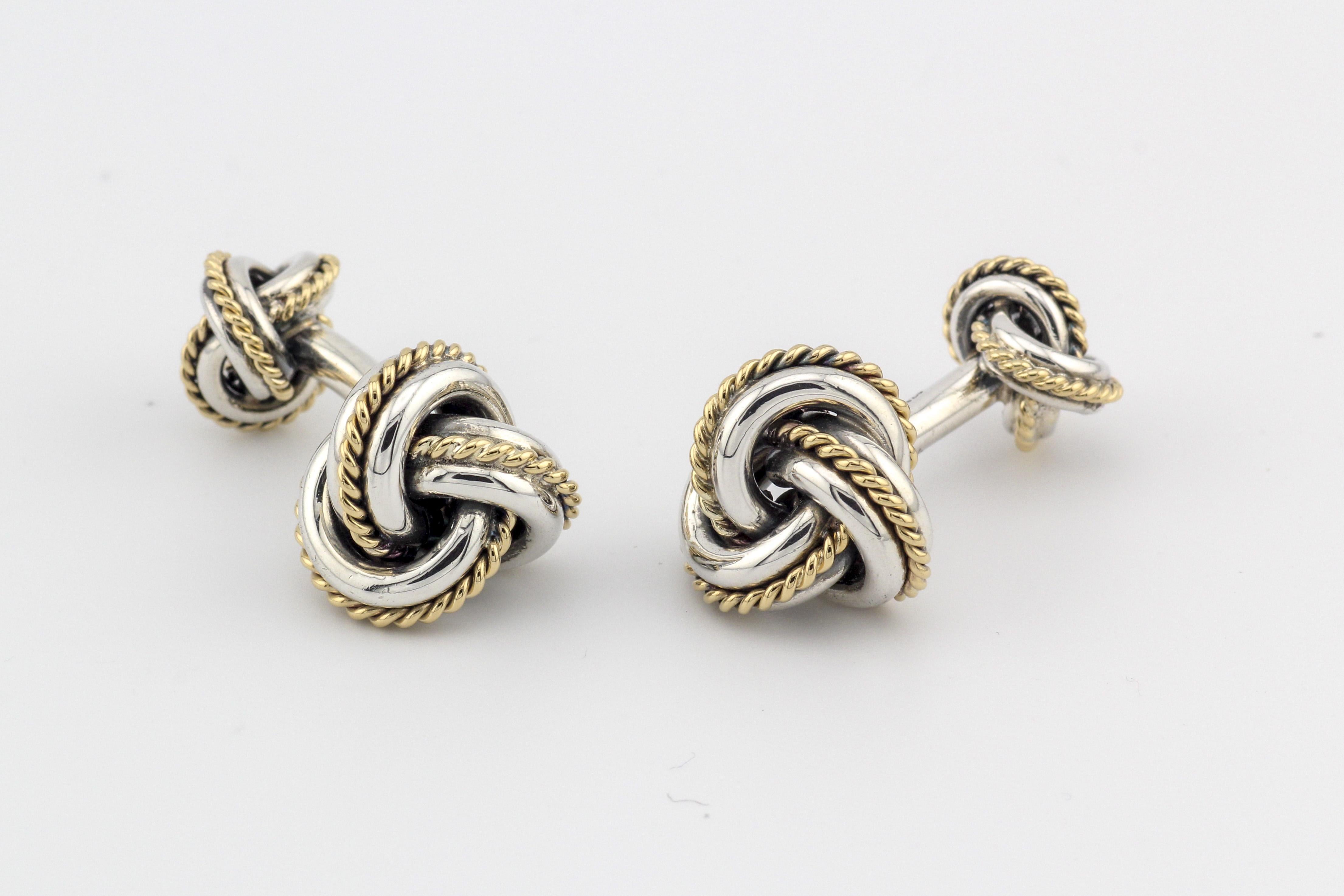 The Tiffany & Co. 18K Yellow Gold Sterling Silver Rope Knot Cufflinks are a testament to the brand's legacy of fine craftsmanship and timeless elegance. These cufflinks are a perfect fusion of luxurious 18K yellow gold and sterling silver, resulting
