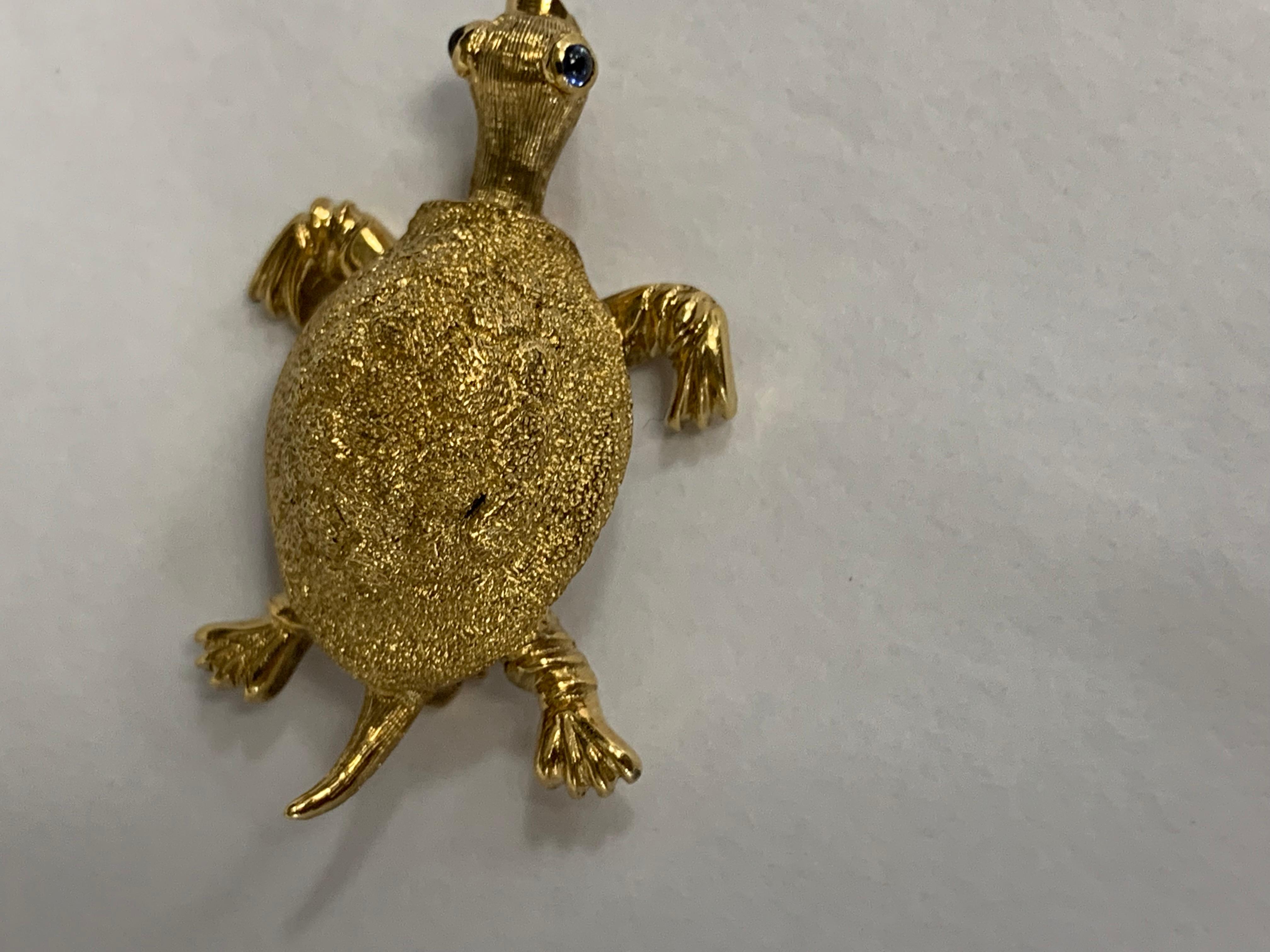 18k texture turtle pin by Tiffany and Company
2 cabochon sapphires for eyes
8.7 grams