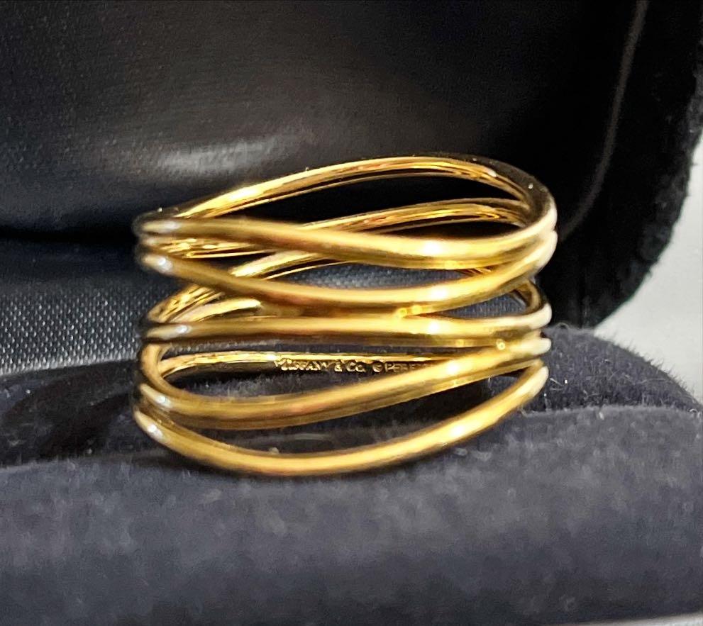 This beautiful 18K gold Tiffany's ring is designed by Elsa Peretti.  It is part of her Wave collection which 