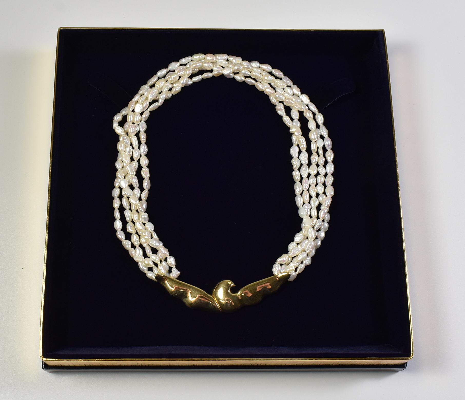 Tiffany & Co 18K multi-strand freshwater pearl necklace by Paloma Picasso. Dove motif clasp, 5 strands of pearls, 16