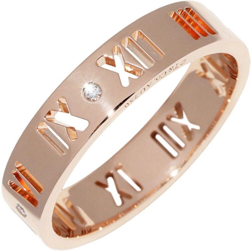 TIFFANY & Co. 18K Rose Gold Diamond 5mm Atlas Pierced Ring 10
 
 Metal: 18K Rose Gold 
 Size: 10 
 Band Width: 5mm
 Diamond: 4 round brilliant diamonds, carat total weight .04 
 Hallmark: ©T&Co. AU750 
 Condition: Excellent condition, like new 

