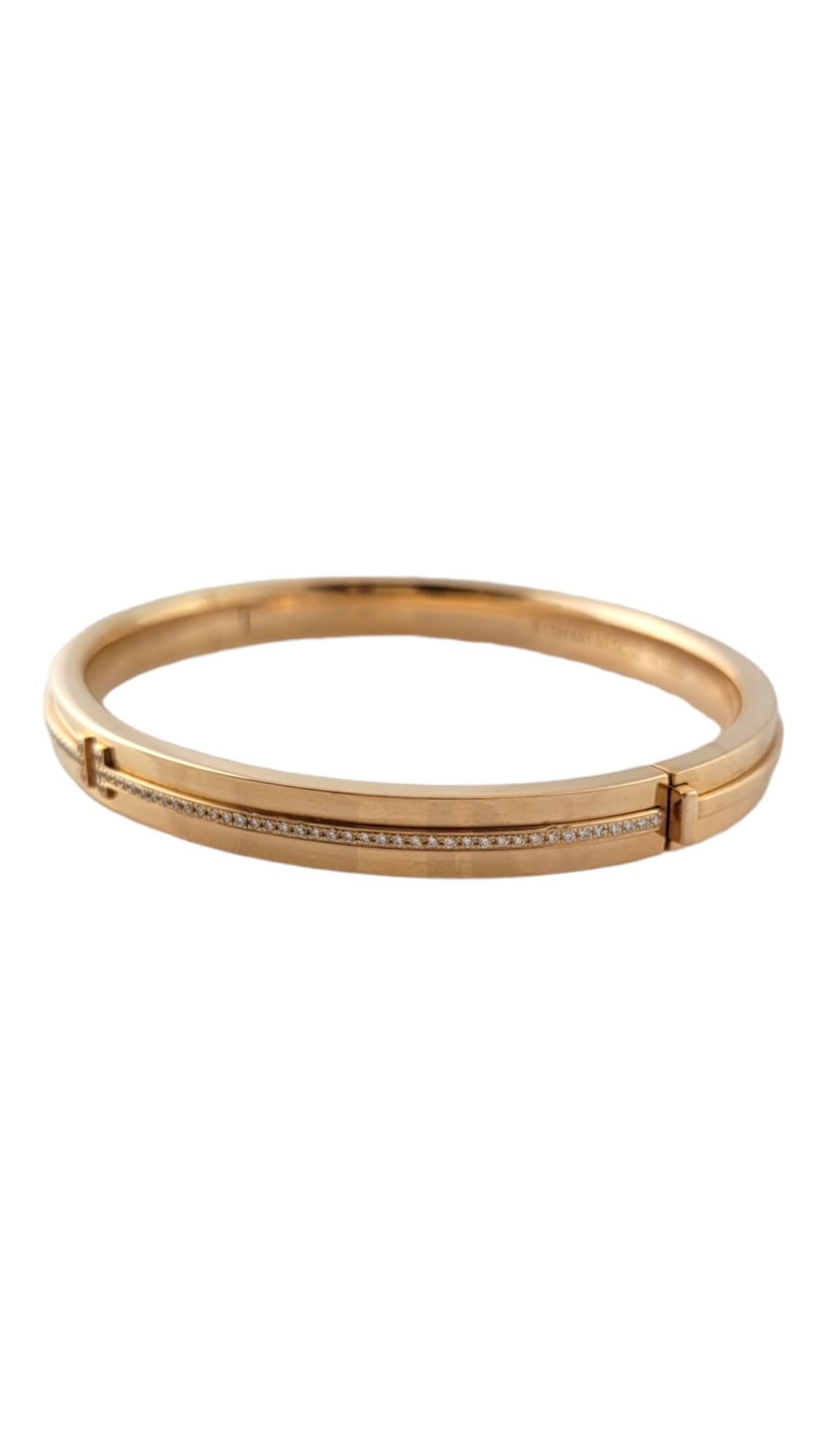 Tiffany & Co. 18K Rose Gold Diamond T Hinged Bangle Bracelet

This stunning T hinged bangle by designer Tiffany & Co. was crafted from 18 karat rose gold is decorated with 85 stunning round brilliant cut diamonds that will give you a beautiful
