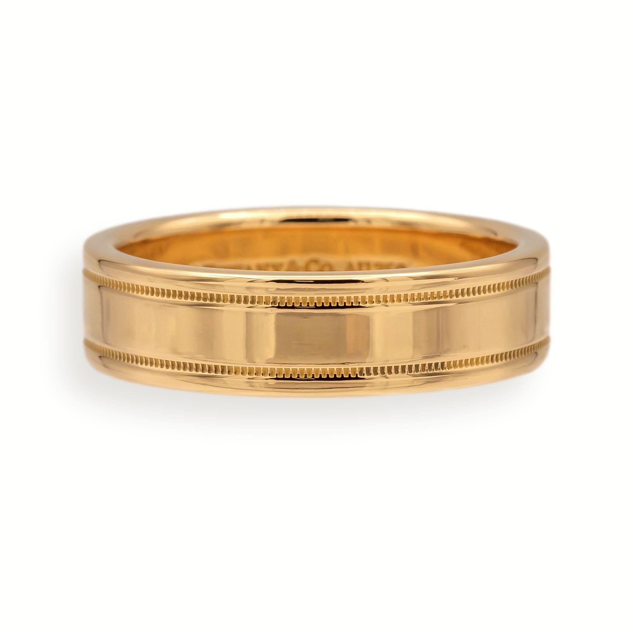 This classic Tiffany & Co. men's band is crafted in rich 18K rose gold and features the refined Essential Double Milgrain design. The ring measures 6.1 mm wide and weighs 10.8 grams, offering a substantial feel with elegant detailing. A timeless