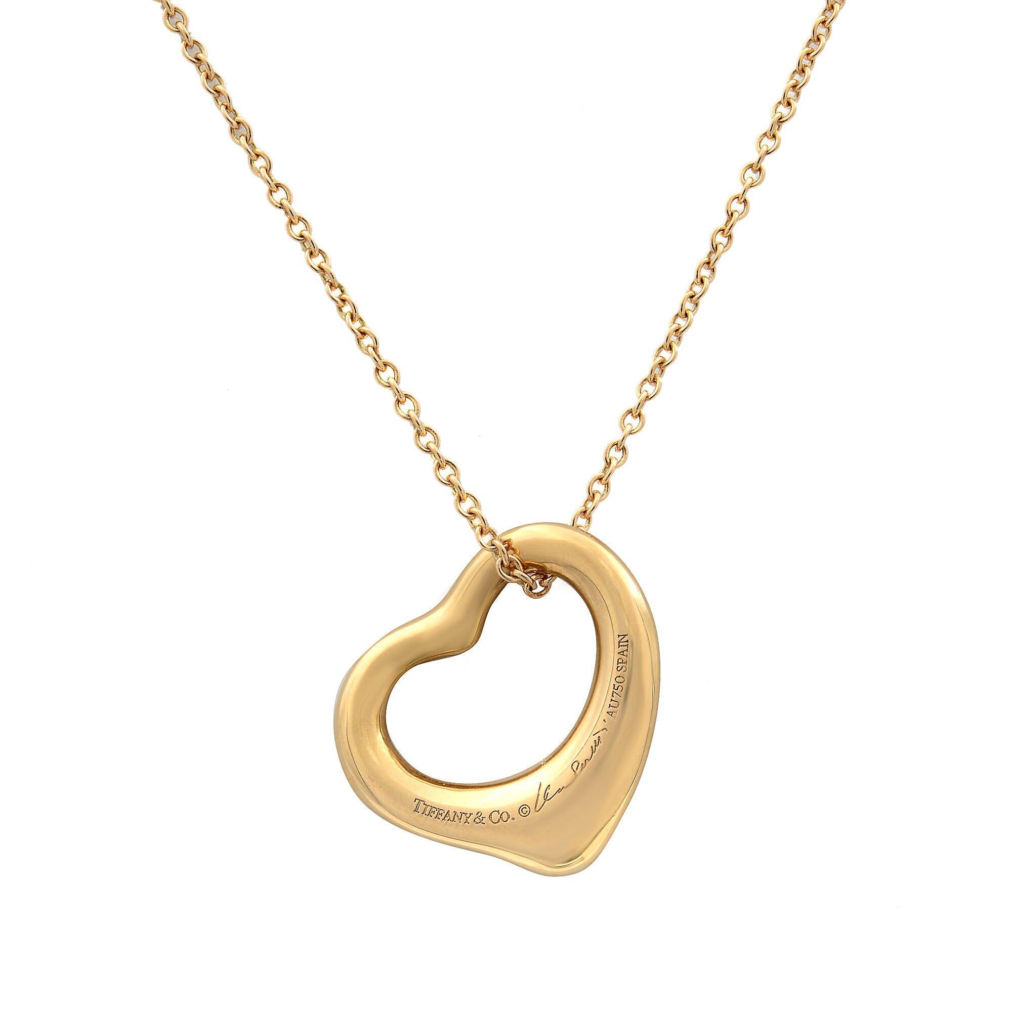 This is Tiffany's simple, evocative shape of Elsa Peretti Open Heart. This design celebrates the spirit of love. Brilliant diamonds accentuate the elegant curves of this pendant. Size small. 18k gold with diamonds, 0.02cts. Chain Length: 16 inches.