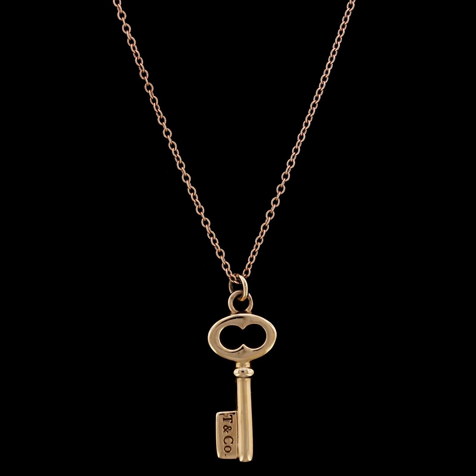 Tiffany & Co. 18K Rose Gold Key Pendant Necklace. The key measures 7/8