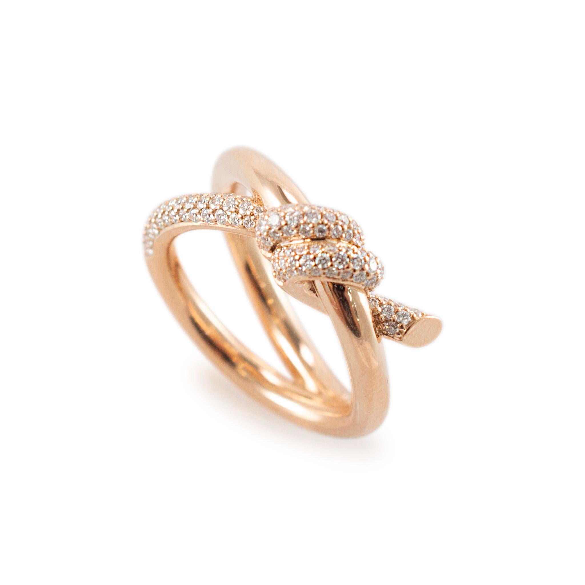 Brand: Tiffany & Co.

Gender: Ladies

Metal Type: 18K Rose Gold

Ring Size: 6

Width: 9.00 mm

Weight: 9.99 grams

Ladies 18K Rose Gold diamond cocktail ring with a braided/twisted shank. The metal was tested and determined to be 18K rose gold.