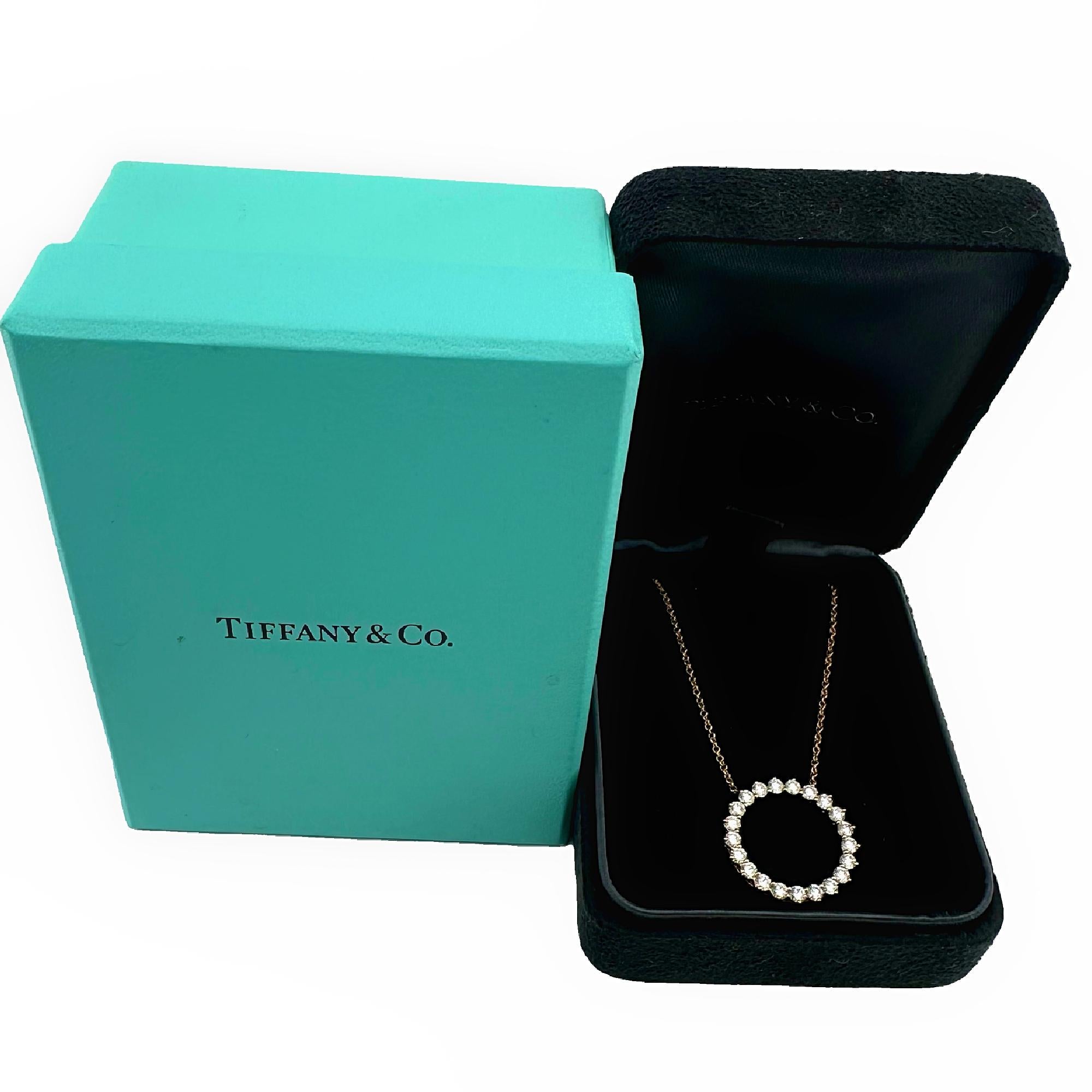 Tiffany & Co. Open Circle Diamond Pendant Necklace
Style:  Prong Set
Metal:  18k Rose Gold
Measurements:  18' Inches
Main Diamond:  21 Round Brilliant Diamond 0.93 cts
Color & Clarity: White, Eye Clean
Hallmark:  © TIFFANY&CO. Au750 on