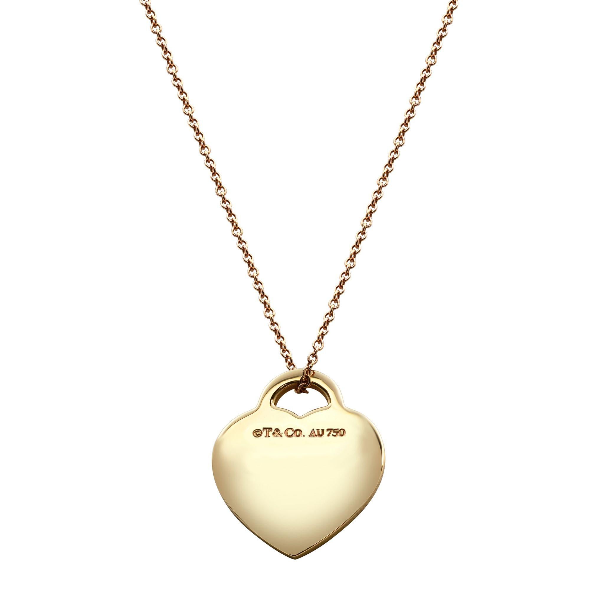 18k rose gold heart tag charm and chain from the Return to Tiffany collection. The heart tag is engraved in the center with the infamous 