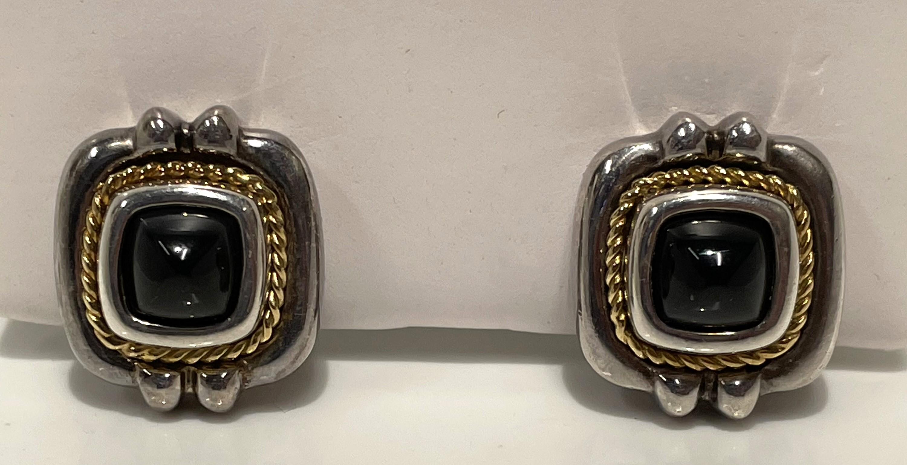 Beautiful Tiffany & Co. earrings that will become your favorite!
18 karat yellow gold and sterling silver.
Sugarloaf cabochon black onyx center stones.
Approximately 17.5mm x 20mm.
Omega clip back with post.
10.9dwt.
Stamped 