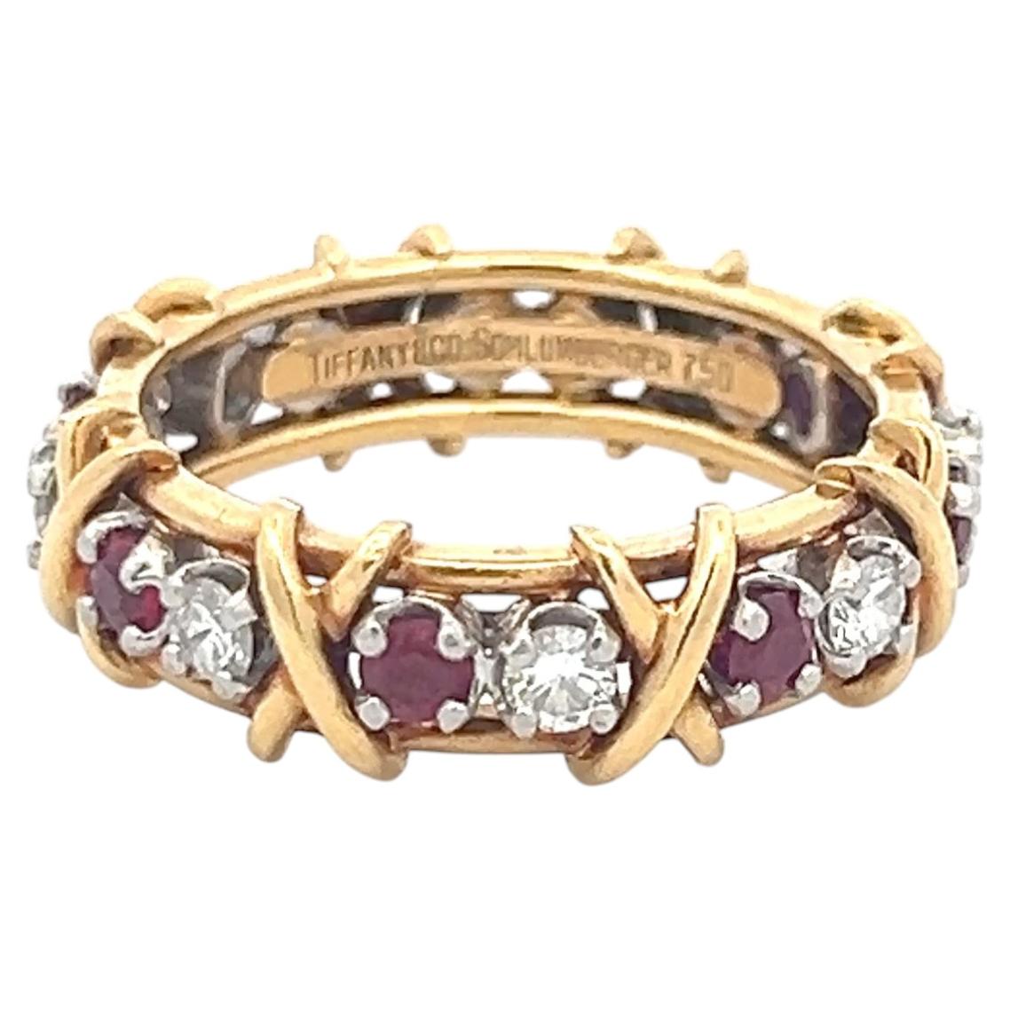 Tiffany & Co. Anello a fascia in oro bicolore 18 carati con diamanti 0,57 carati e rubino 0,65 carati Misura 9