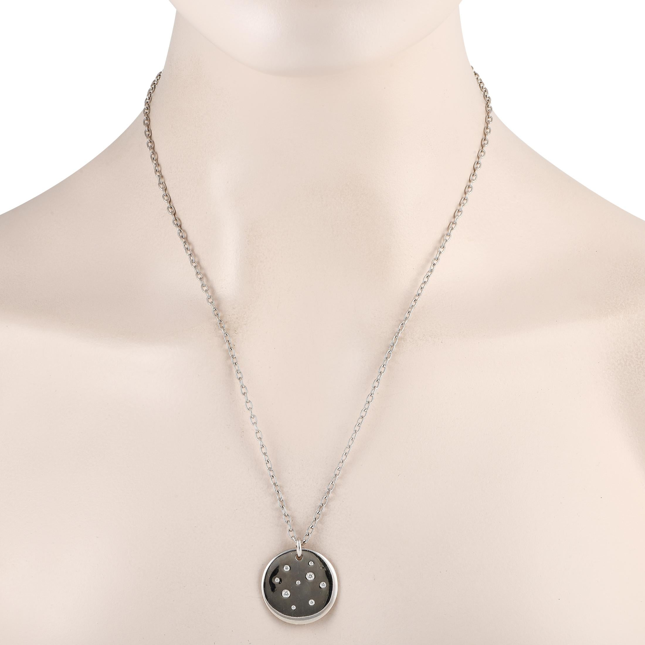 Inset diamonds with a total weight of 0.20 carats make add sparkle to this simple, elegant Tiffany & Co. necklace. Suspended from a 24” chain, you’ll find a circular 18K White Gold pendant measuring 1.0” round. 
 
 This jewelry piece is offered in
