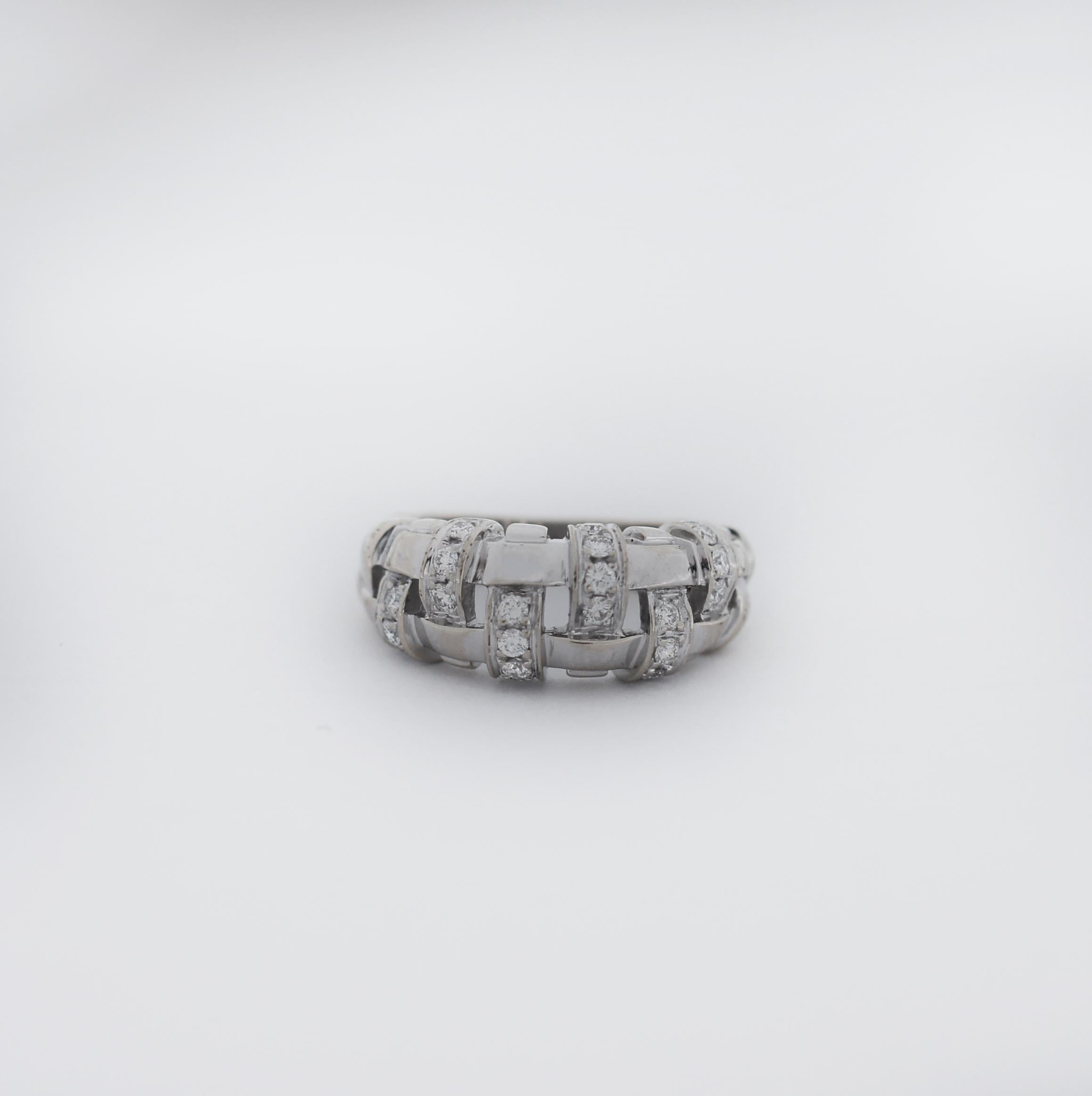 Tiffany & Co.
Vannerie
basket weave
18k white gold
Hallmark: T & Co ©2002 750 Italy
6.6 grams
Approx. measurements:
-Width at top: 9mm
-Height at top: 5mm
-Width at Bottom: 4.03mm
Ring Size 5.5
In great looking condition
wear consistent with time