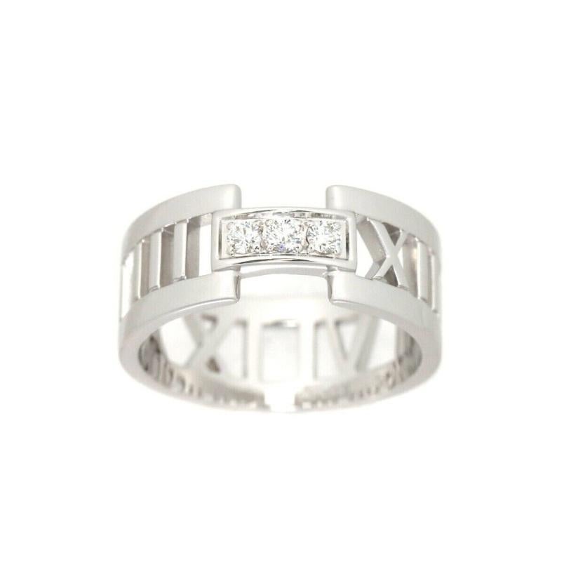 TIFFANY & Co. 18K White Gold Atlas 3 Diamond Open Ring 7

Metal: 18K White Gold
Size: 7
Band Width: 8.5mm
Weight: 6.30 grams
Diamond: 3 round brilliant diamonds, carat total weight .10
Hallmark: ATLAS ©T&Co. 750 ITALY
Condition: Excellent condition,