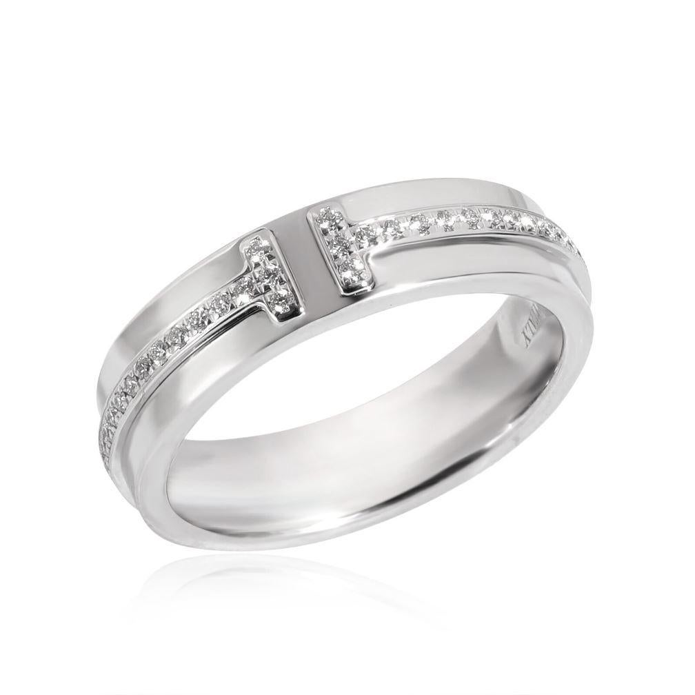 TIFFANY & Co. 18K White Gold 4.5mm Wide Diamond T Ring 5

 Metal: 18K White Gold
 Size: 5
 Band Width: 4.5mm
 Weight: 5.80 grams
 Diamond: round brilliant diamonds, carat total weight .13 
 Hallmark: ©TIFFANY&Co. AU750 ITALY
 Condition: Excellent