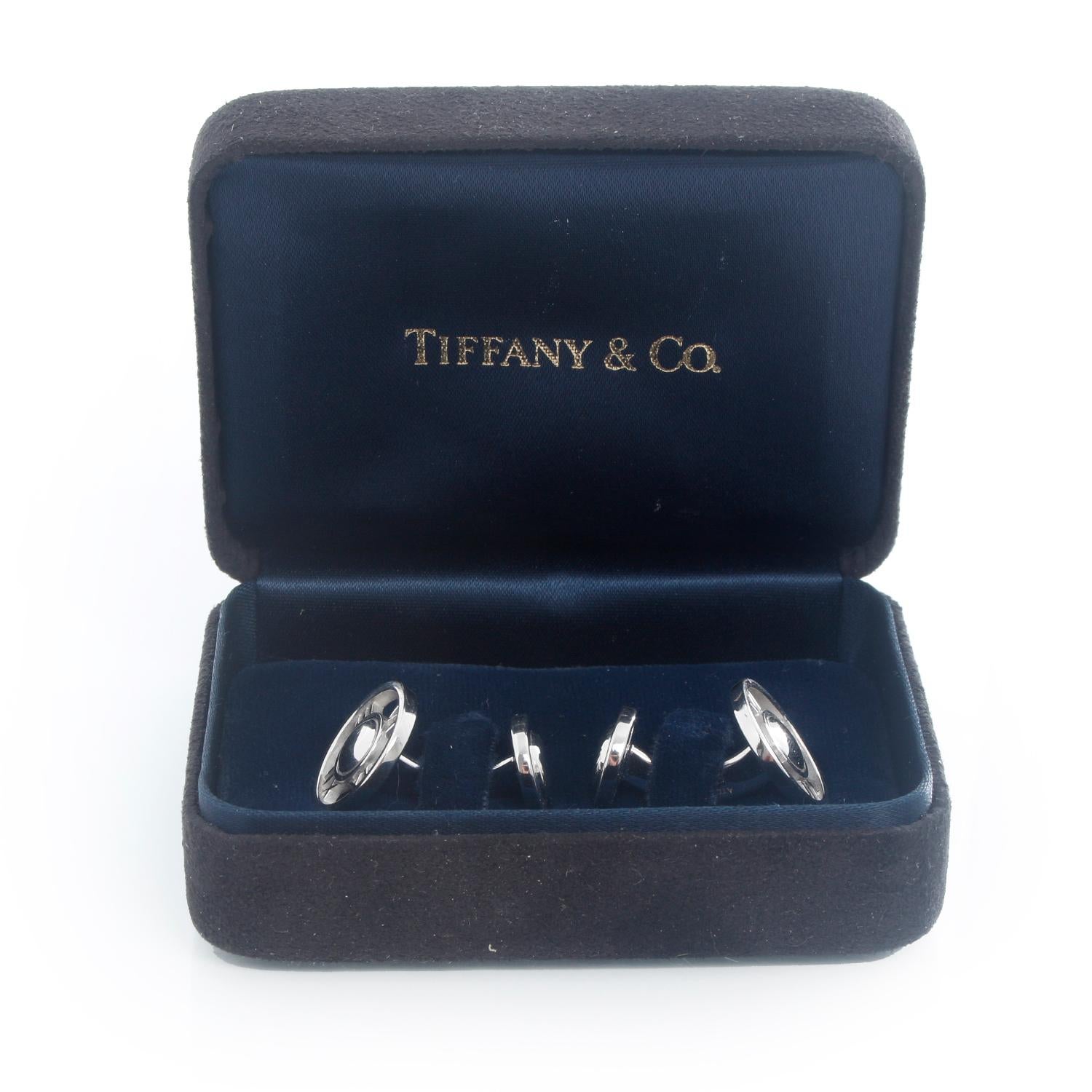 Tiffany & Co. 18K White Gold Atlas Cufflinks  - Tiffany & Co. 18K White Gold Round Atlas Roman Numeral Cuff links Hallmarked; makers mark, 750, ITALY 
Measurement :25 mm x 15 mm
Total weight: 14.97 grams 
Pre-owned with Tiffany & box .