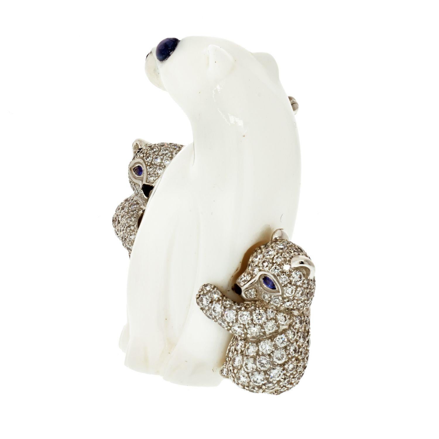 Tiffany White Chalcedony Polar Bear and Diamond Cubs with Sapphire and Black Enamel in 18K White Gold Brooch.
Length: 38mm
Width: 34mm at it's widest. Good. Polar bear has some damage to the chalcedony. Not obvious.
