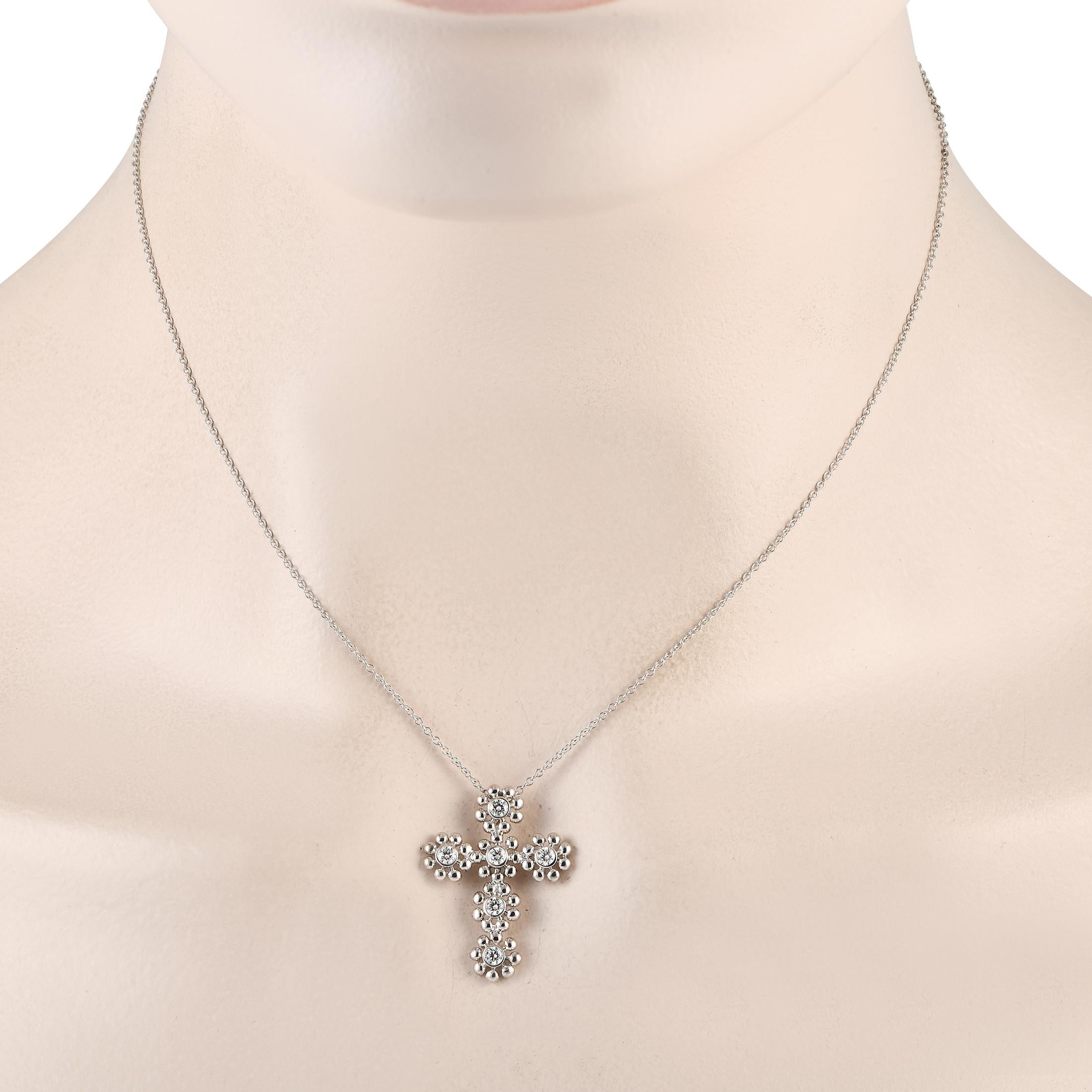 This luxurious necklace from Tiffany & Co. will serve as a scintillating symbol of your faith. The cross-shaped pendant is crafted from 18K White Gold and is elevated by sparkling diamonds with a total weight of 0.30 carats. It\u2019s suspended from