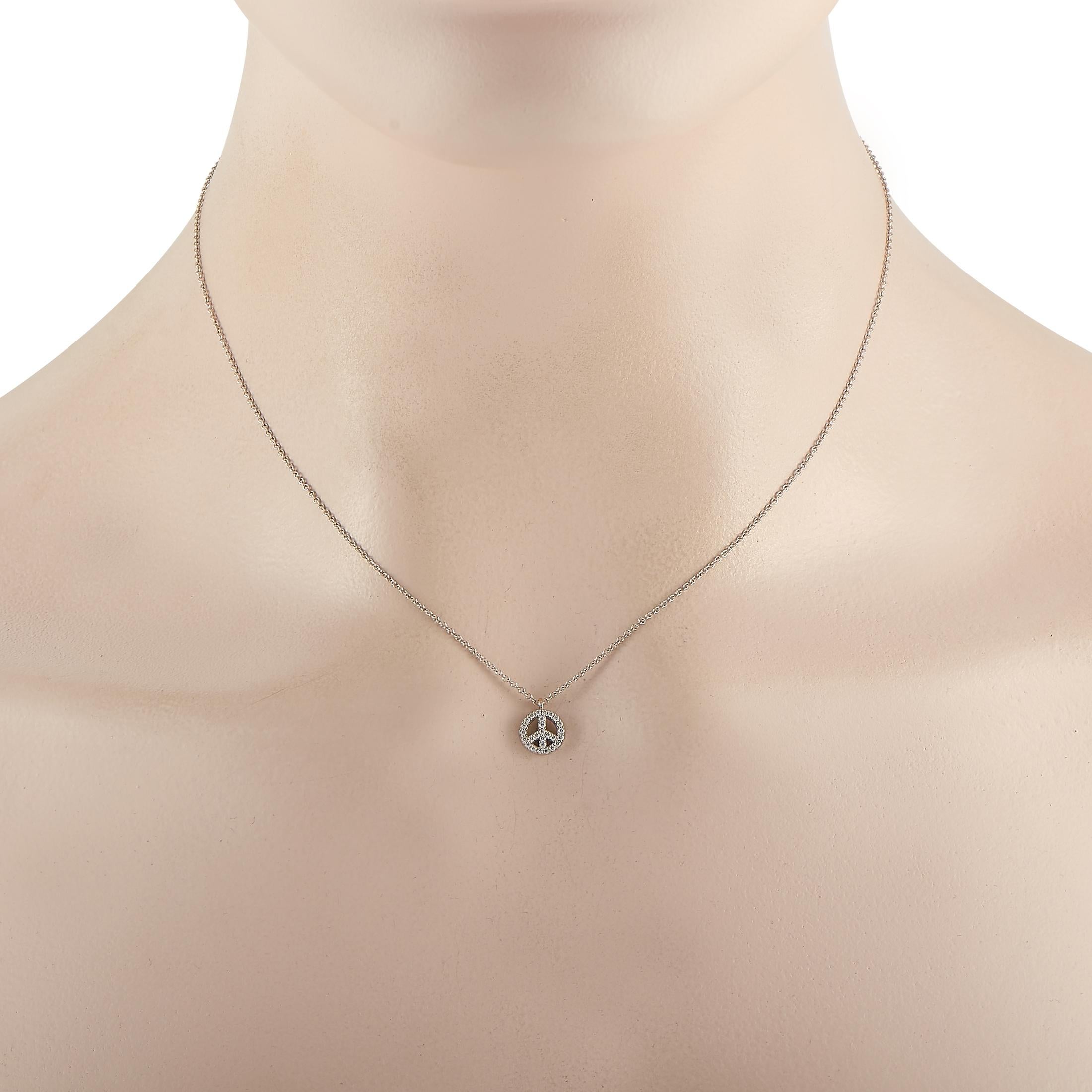 Make a meaningful statement with your choice of jewelry by adding the Tiffany & Co. 18K White Gold Diamond Peace Sign Necklace to your collection. This tastefully designed jewel features a glittering pendant fashioned in the widely recognized peace