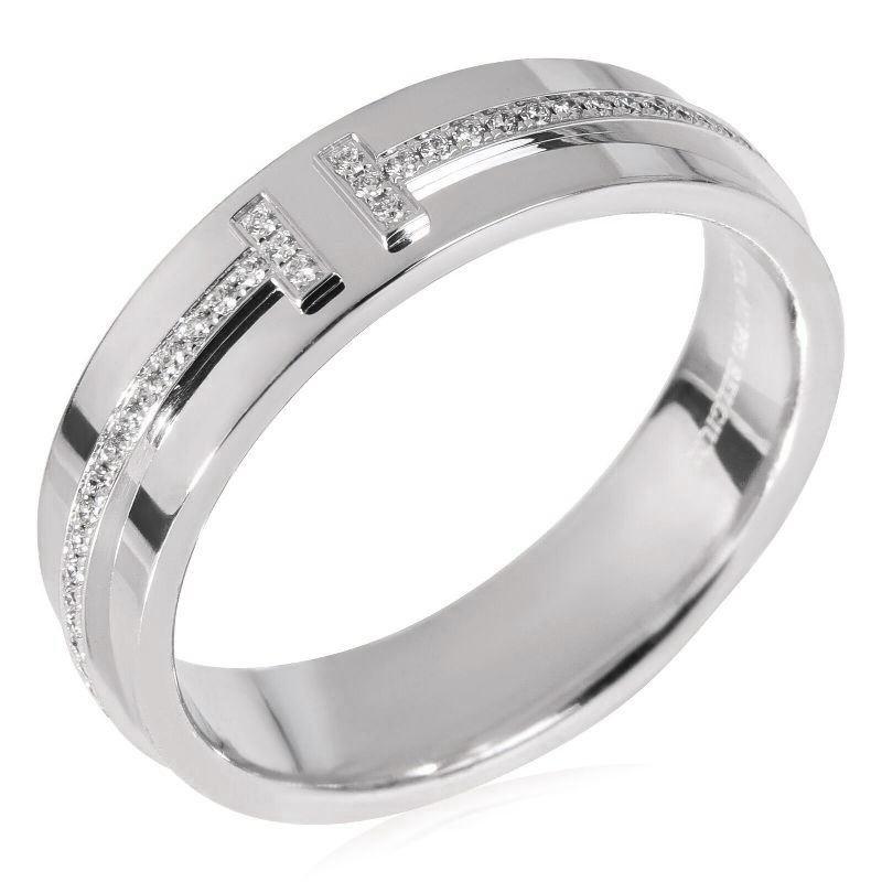TIFFANY & Co. 18K White Gold 5.5mm Wide Diamond T Ring 8

 Metal: 18K White Gold
 Size: 8
 Band Width: 5.5mm
 Weight: 7.70 grams
 Diamond: round brilliant diamonds, carat total weight .13 
 Hallmark: ©TIFFANY&Co. AU750 BELGIUM
 Condition: Excellent