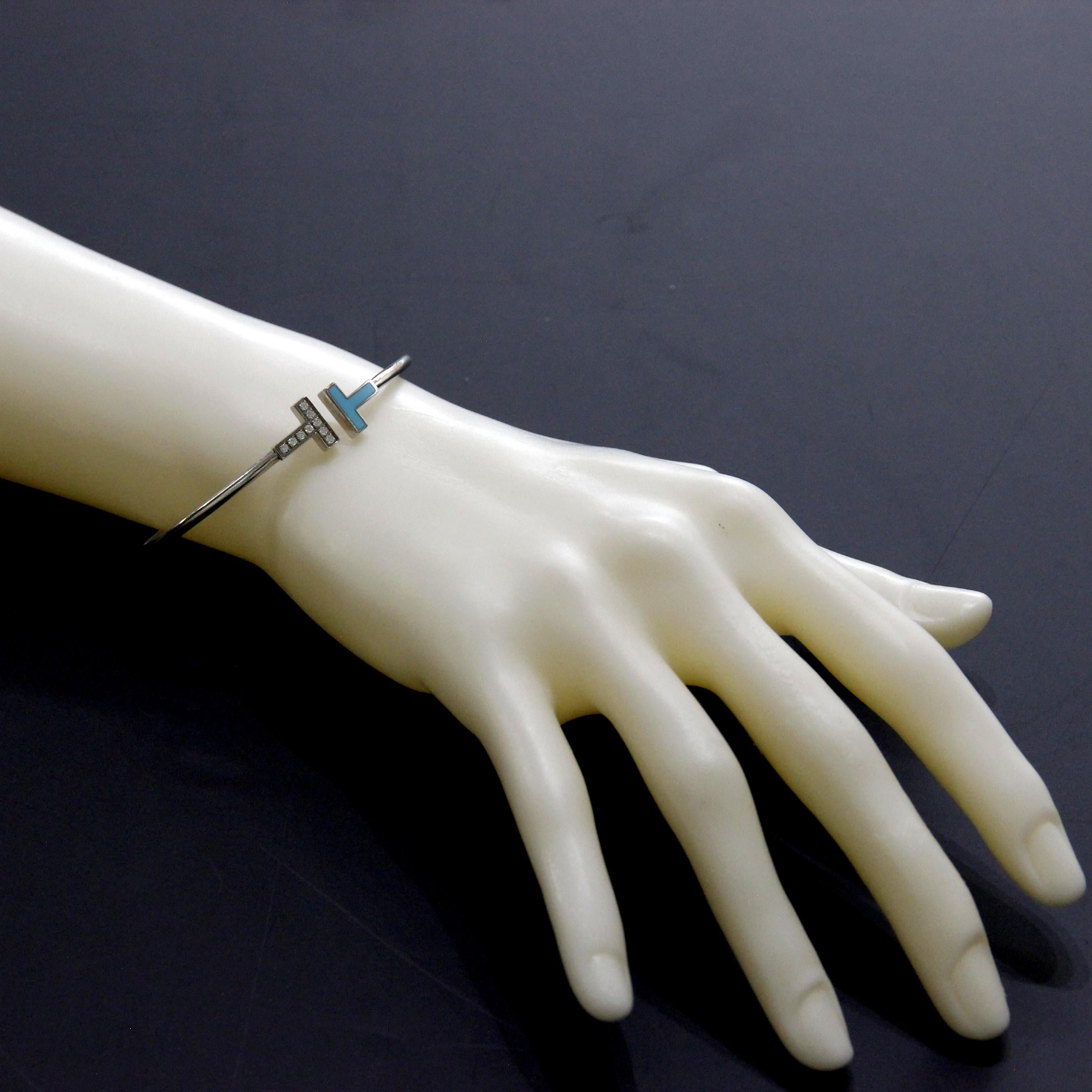 Tiffany & Co Or blanc 18K Diamant  Bracelet AT&T    
Or blanc 18k avec turquoise et diamants ronds de taille brillant
Taille Moyenne
Diamants 0.11ctw      
